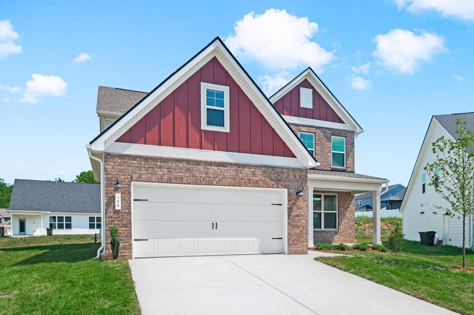 Two-story brick exterior of The Ash A floor plan by Davidson Homes in Woods Crossing, Gallatin, Tennessee.