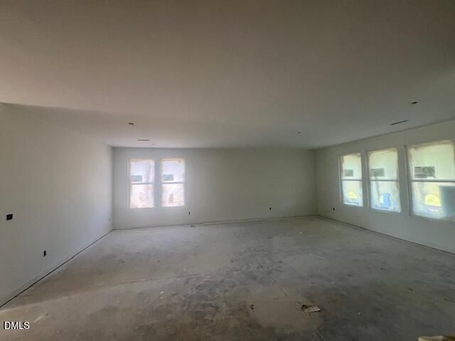 Spacious open-concept great room under construction in The Magnolia II B by Davidson Homes at Retreat at North Main, Lillington, NC