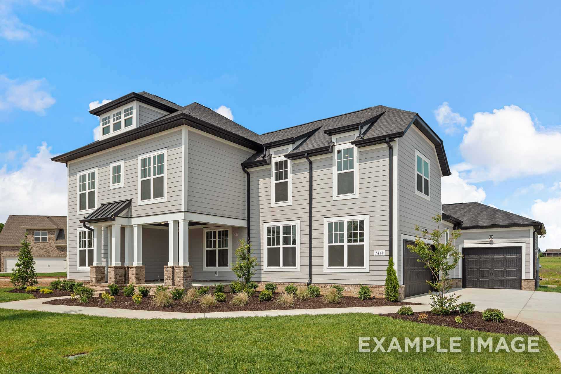 Two-story Hathaway home elevation with gray siding, black trim, covered porch, and 3-car garage amid landscaped yard in Murfreesboro