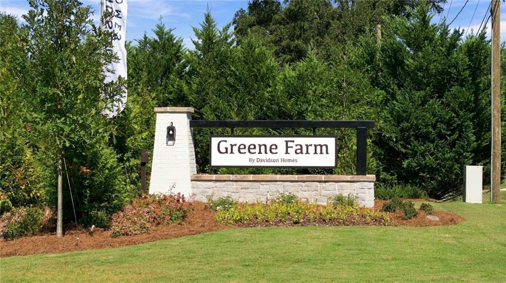 Greene Farm entrance sign by Davidson Homes with landscaped greenery in Cartersville, Georgia new home community