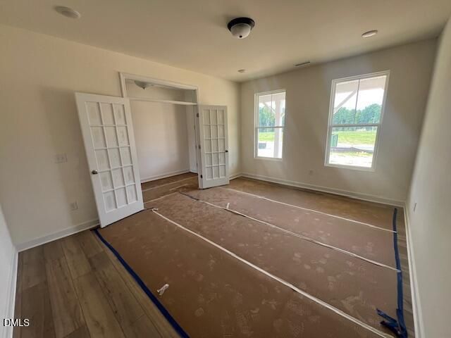 Bright home office with French doors in The Hickory II B floor plan at Retreat at North Main in Lillington, NC.