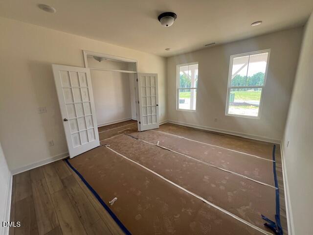 Bright home office with French doors in The Hickory II B floor plan at Retreat at North Main in Lillington, NC.