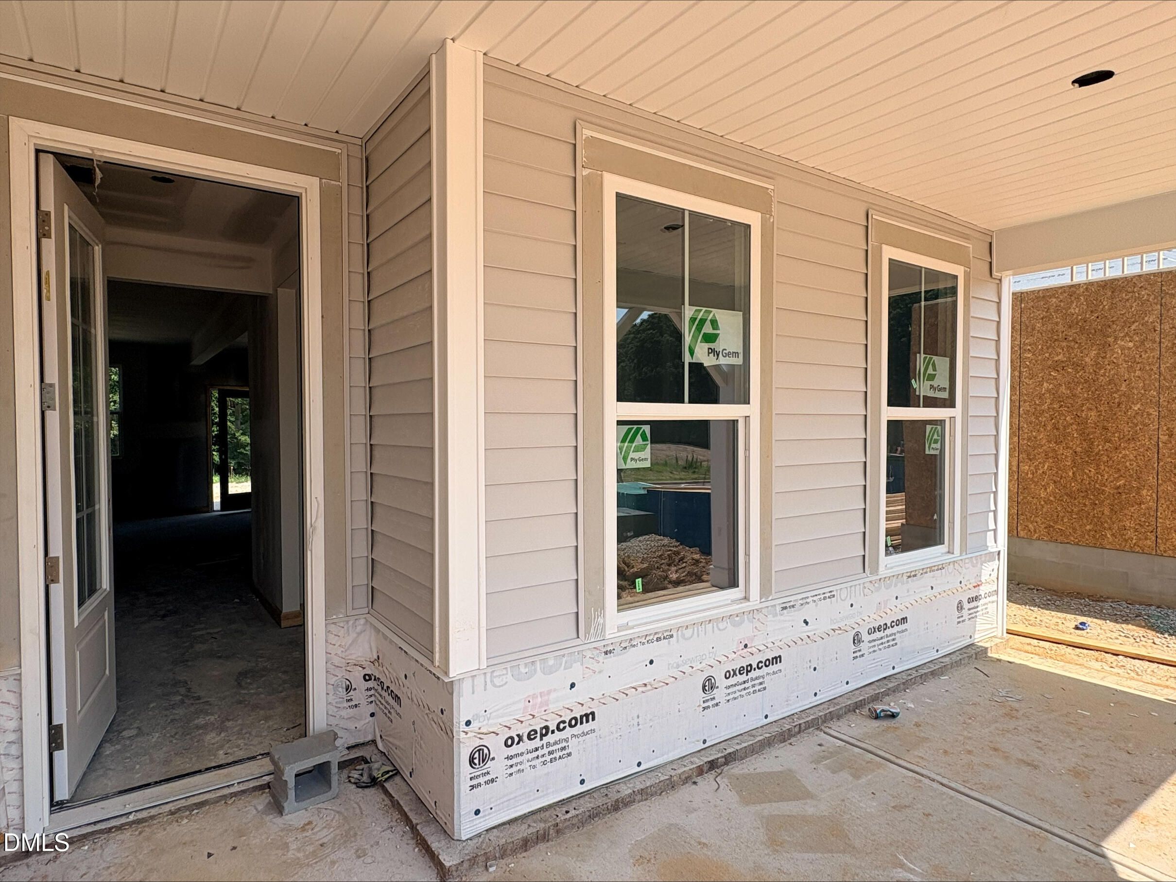 Exterior view of a Davidson Homes Willow B floor plan under construction in Woodland Crossing, Zebulon, North Carolina.