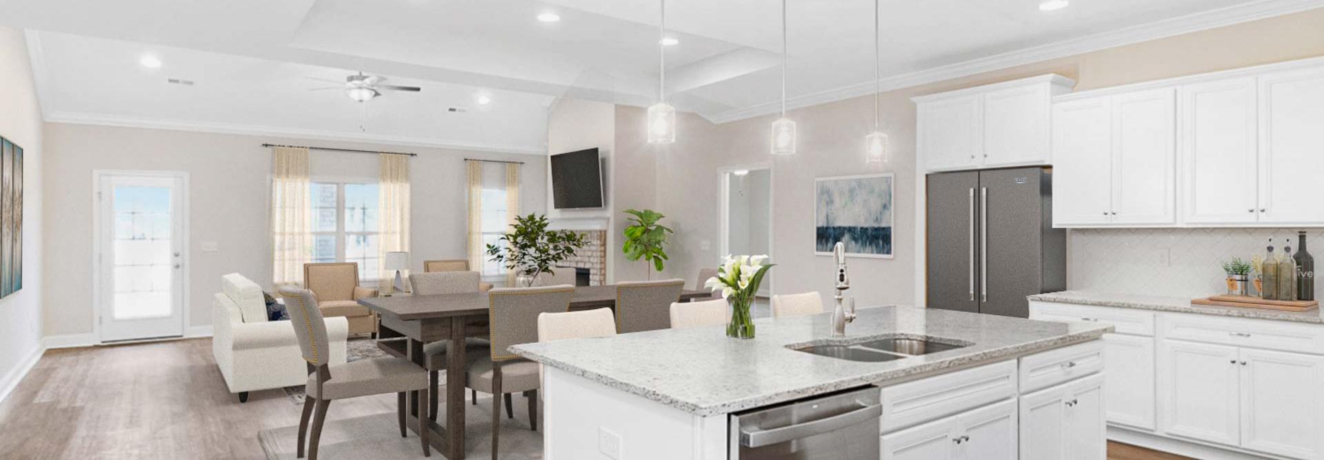 Spacious open-concept kitchen dining living area at Huntington Park in Priceville Alabama with white island hardwood floors