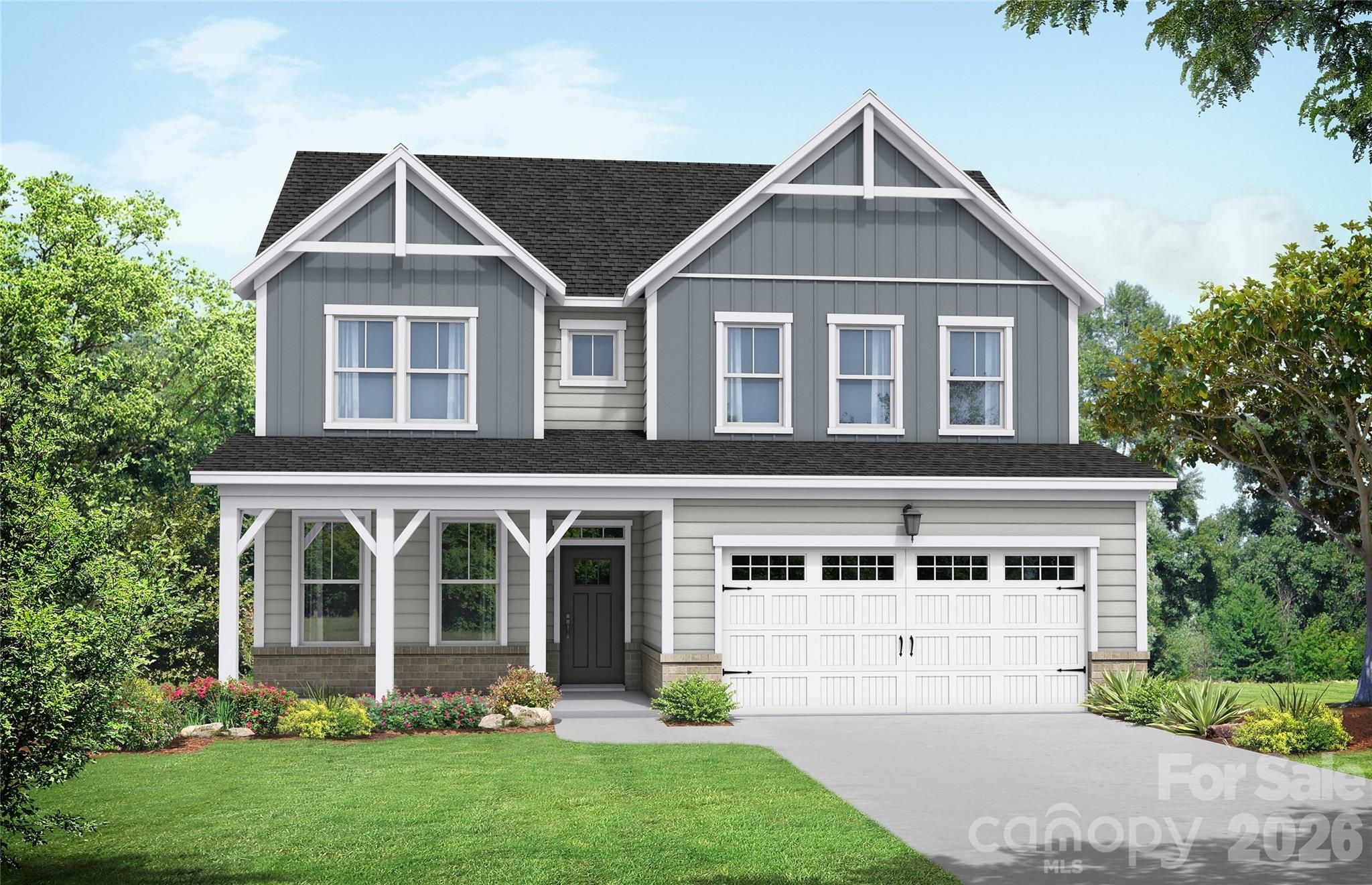 Two-story gray farmhouse-style home with covered front porch and 2-car garage in Windgate, Mooresville, NC by Davidson Homes