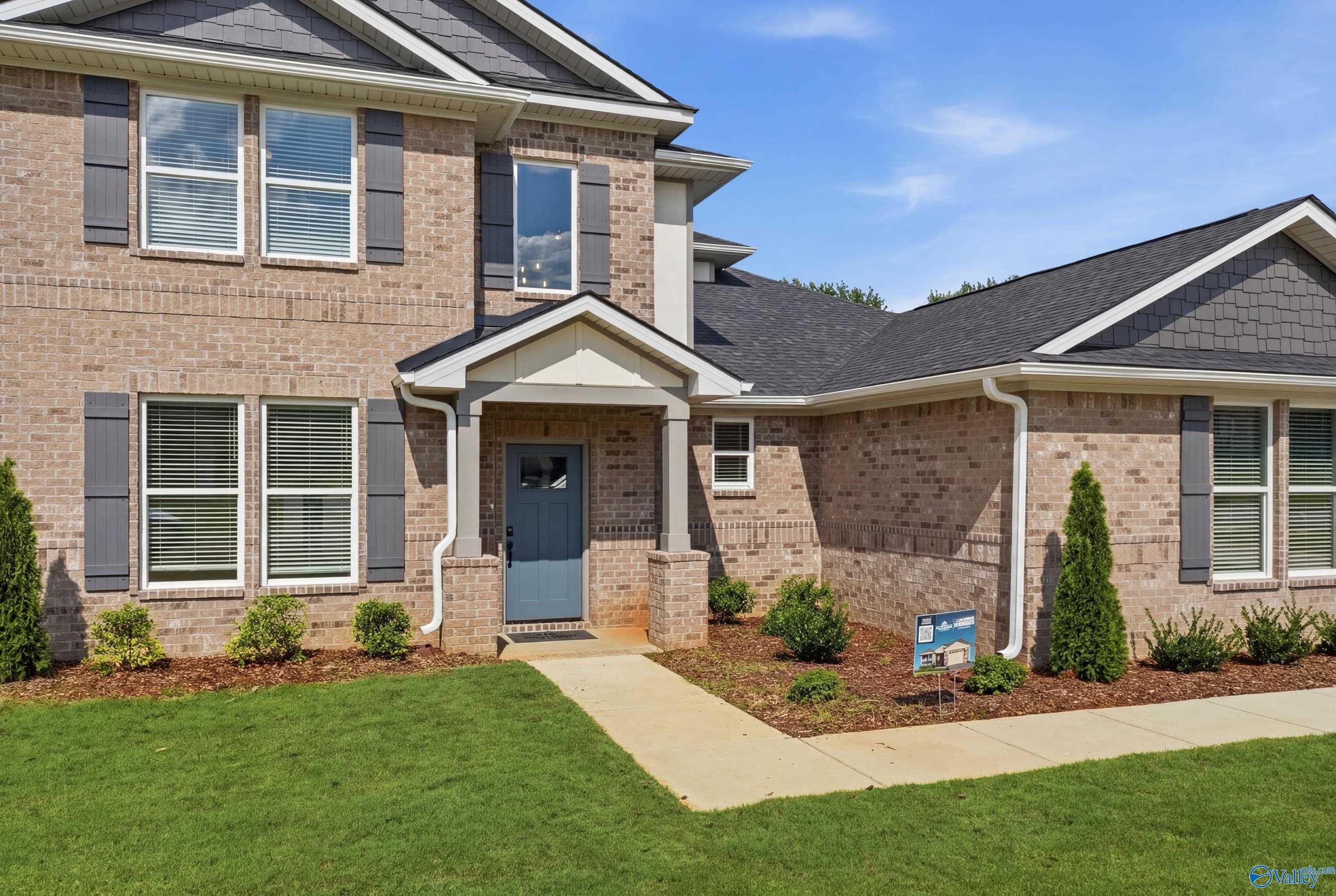 Two-story brick exterior of The Dorado floor plan by Davidson Homes in Riverton Preserve, Huntsville, Alabama.