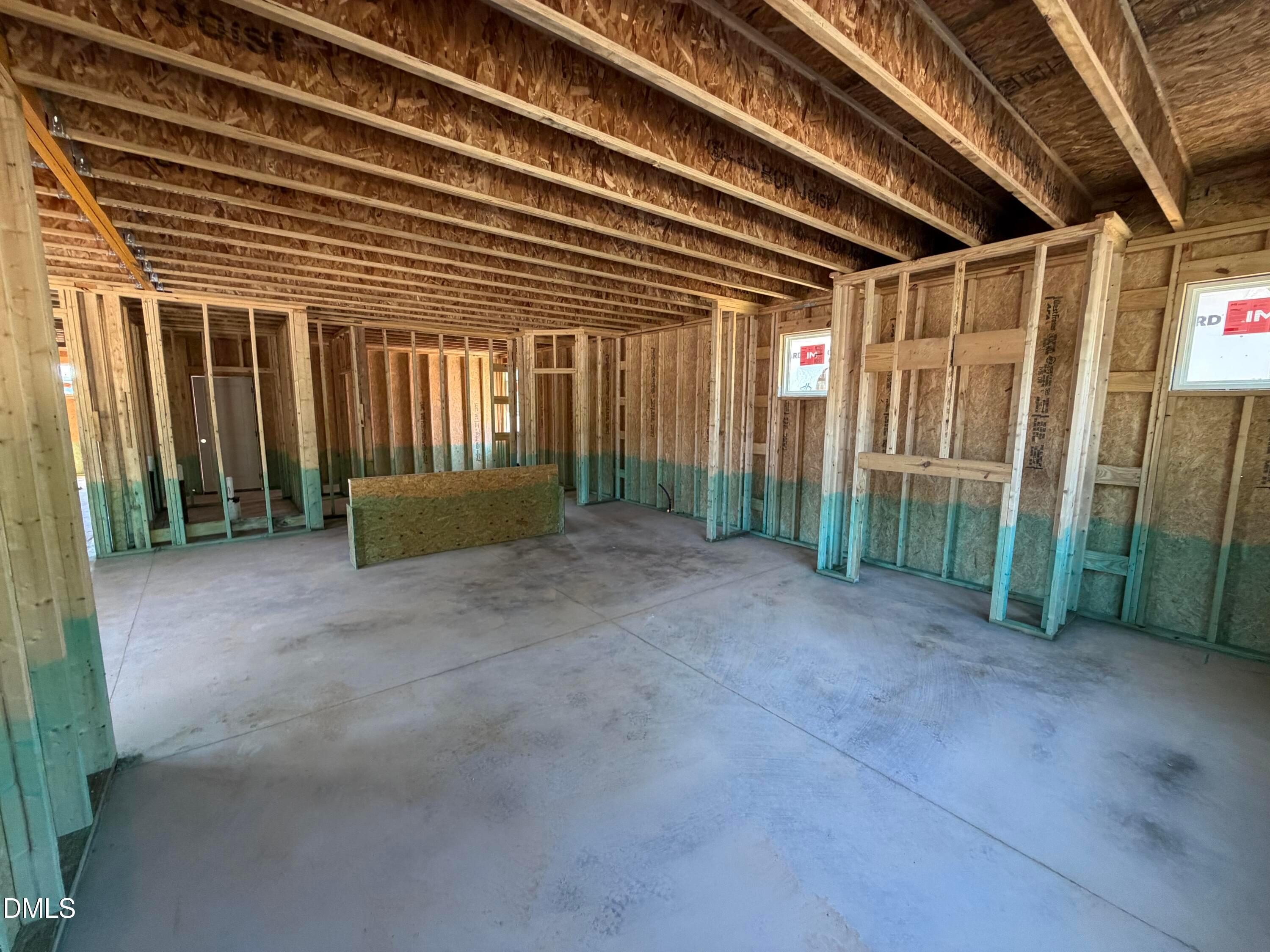 Open-frame construction of a new home interior in the Preston C floor plan at Wendell Ridge, Wendell, North Carolina.