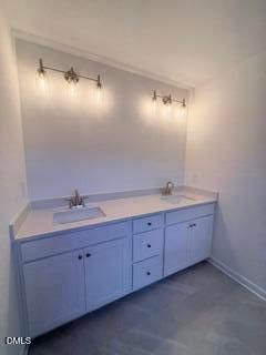 Double vanity with modern lighting in The Willow B floor plan at Woodland Crossing, Zebulon, North Carolina.