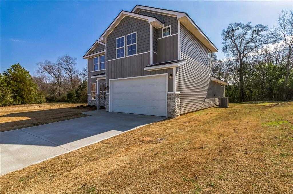 Two-story gray home with attached 2-car garage and driveway in Ivy Glen, Perry, Georgia - Evermore Homes The Stella