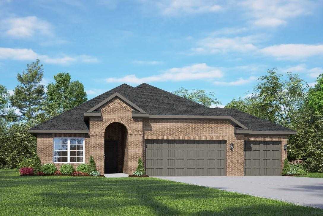 Modern brick one-story home with 3-car garage, arched entry, and lush landscaping in Lago Mar, Texas City - Davidson Homes Acadia A
