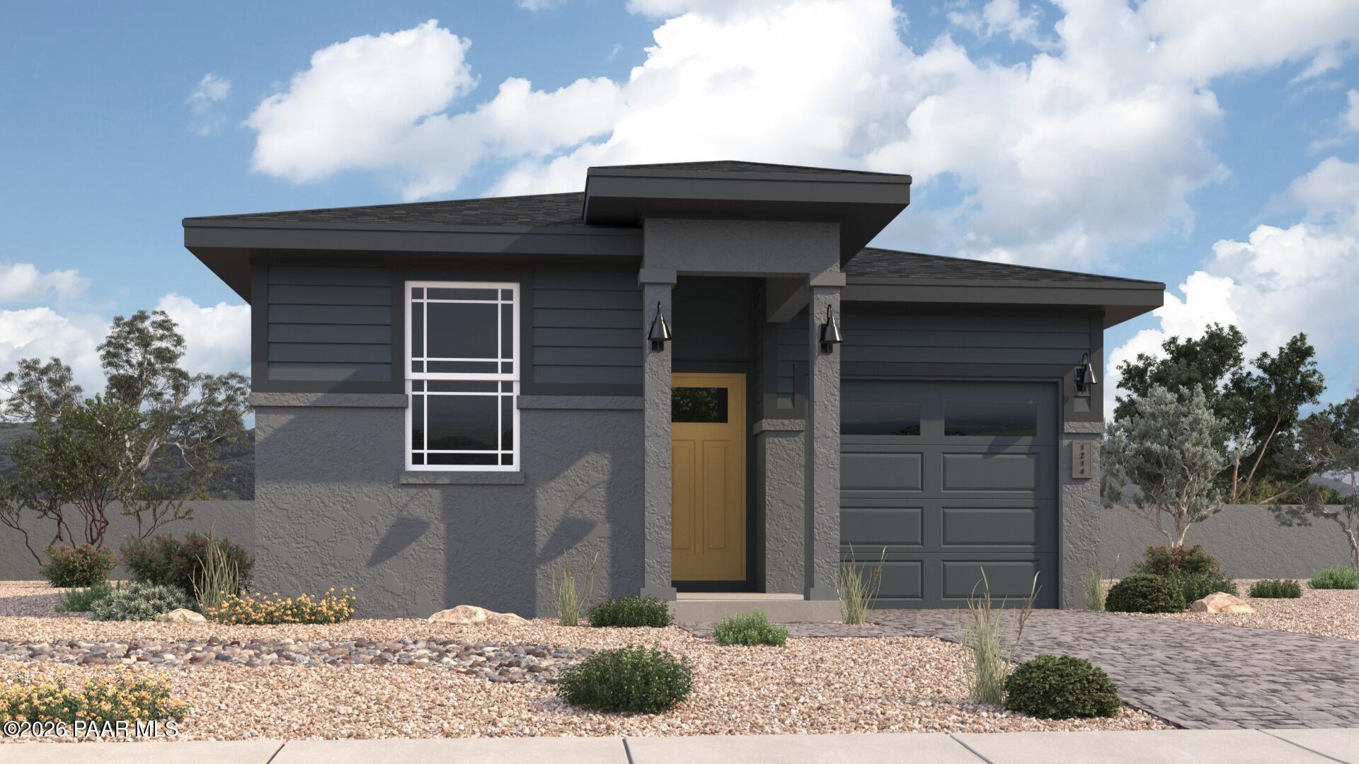 Modern dark gray single-story home with 1.5-car garage, large window, and desert landscaping in Prescott, Arizona - The Savannah A by Davidson Homes