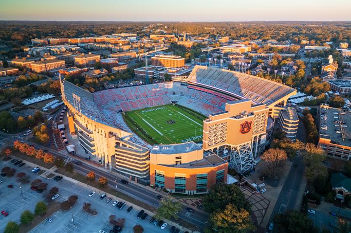 Aerial sunset view of Jordan-Hare Stadium at Auburn University near Anderson Lakes in Opelika Alabama