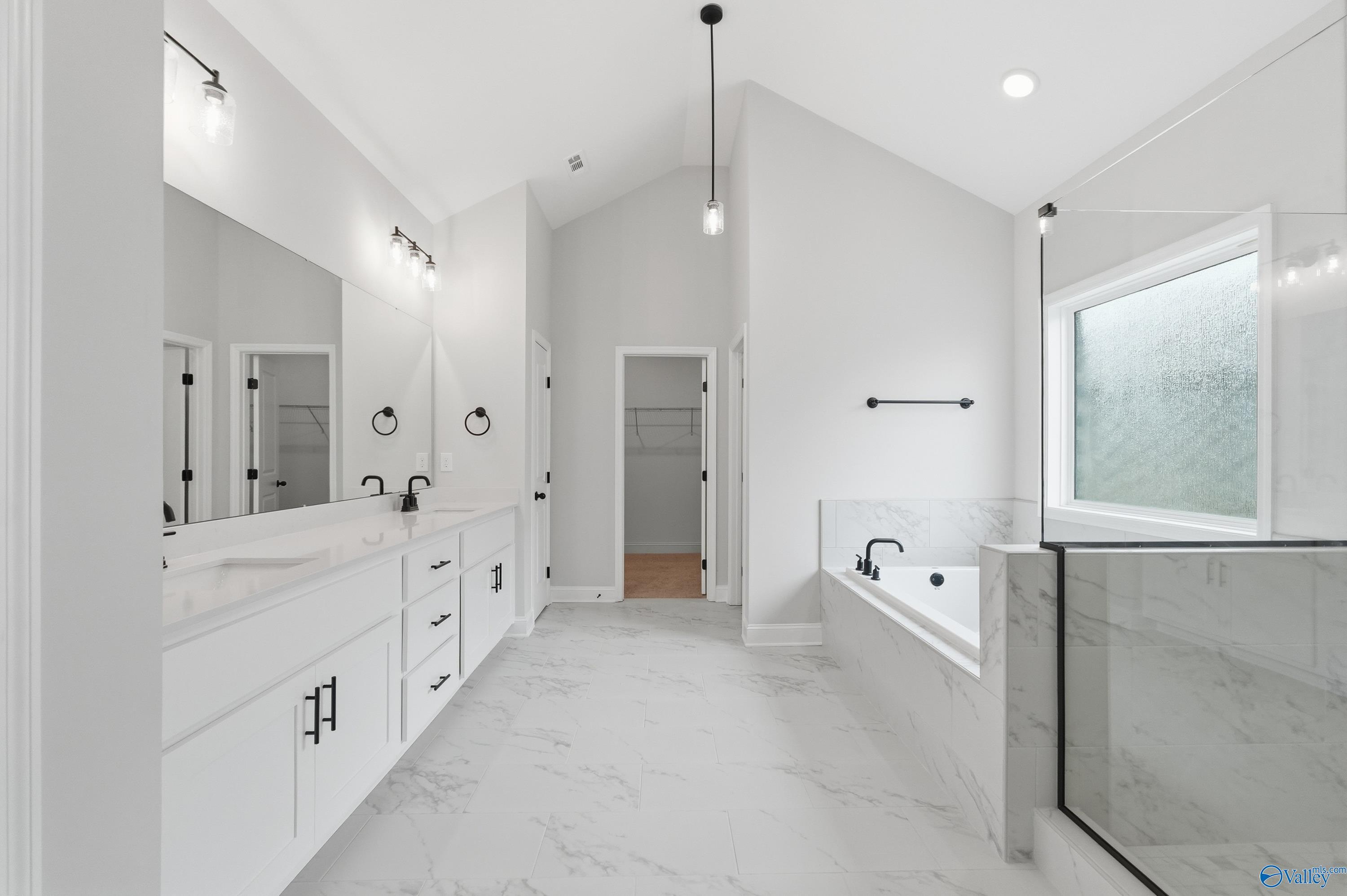 Elegant master bathroom with double vanity, freestanding tub, walk-in shower in Davidson Homes The Finleigh, Meridianville, Alabama