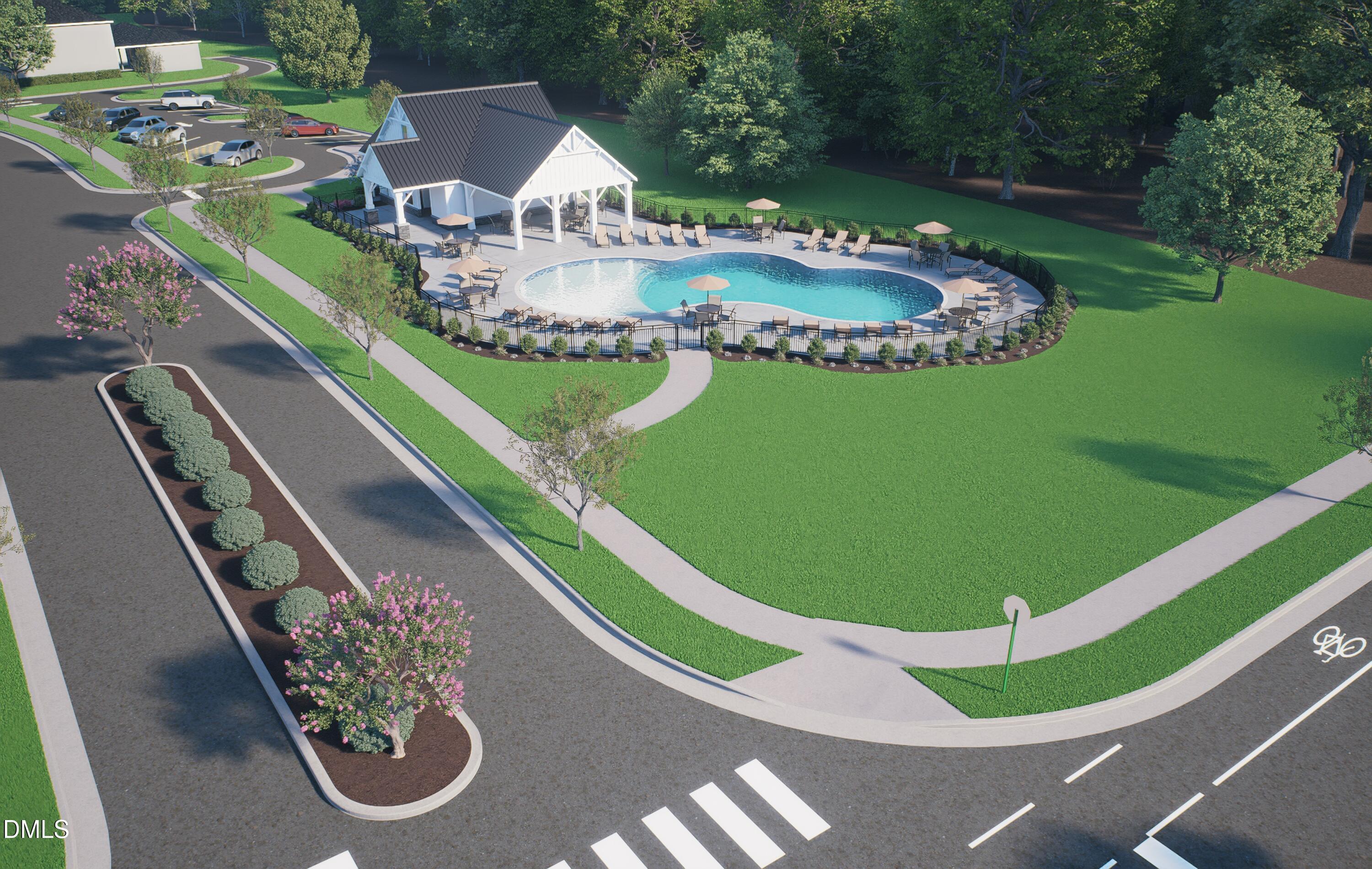 Resort-style community pool with pavilion, lounge chairs and umbrellas in Forestville Yard Townhomes, Knightdale, North Carolina