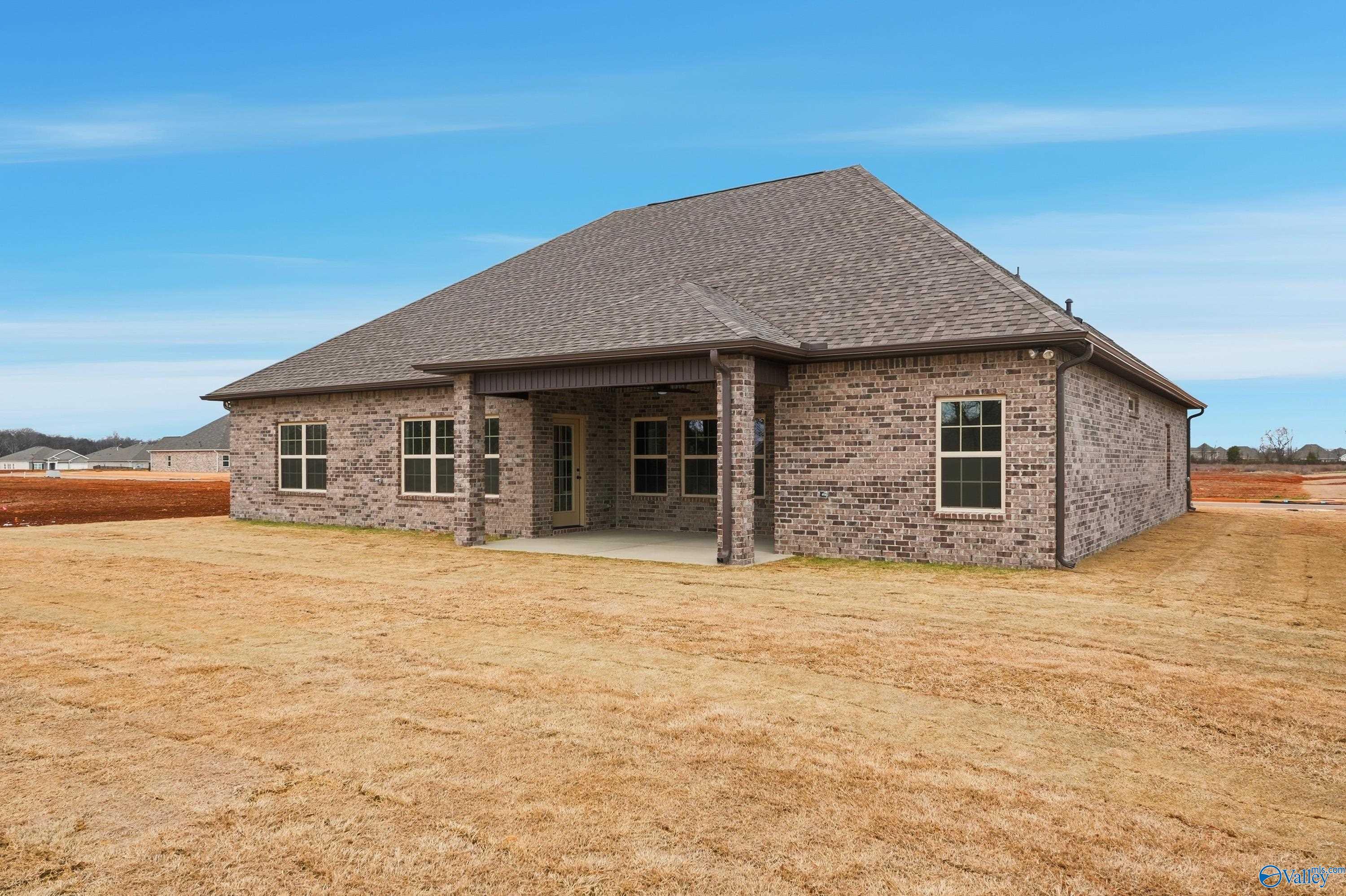 Single-story brick Finleigh home with covered porch, gabled roof, and spacious yard in Briercreek, Meridianville, Alabama