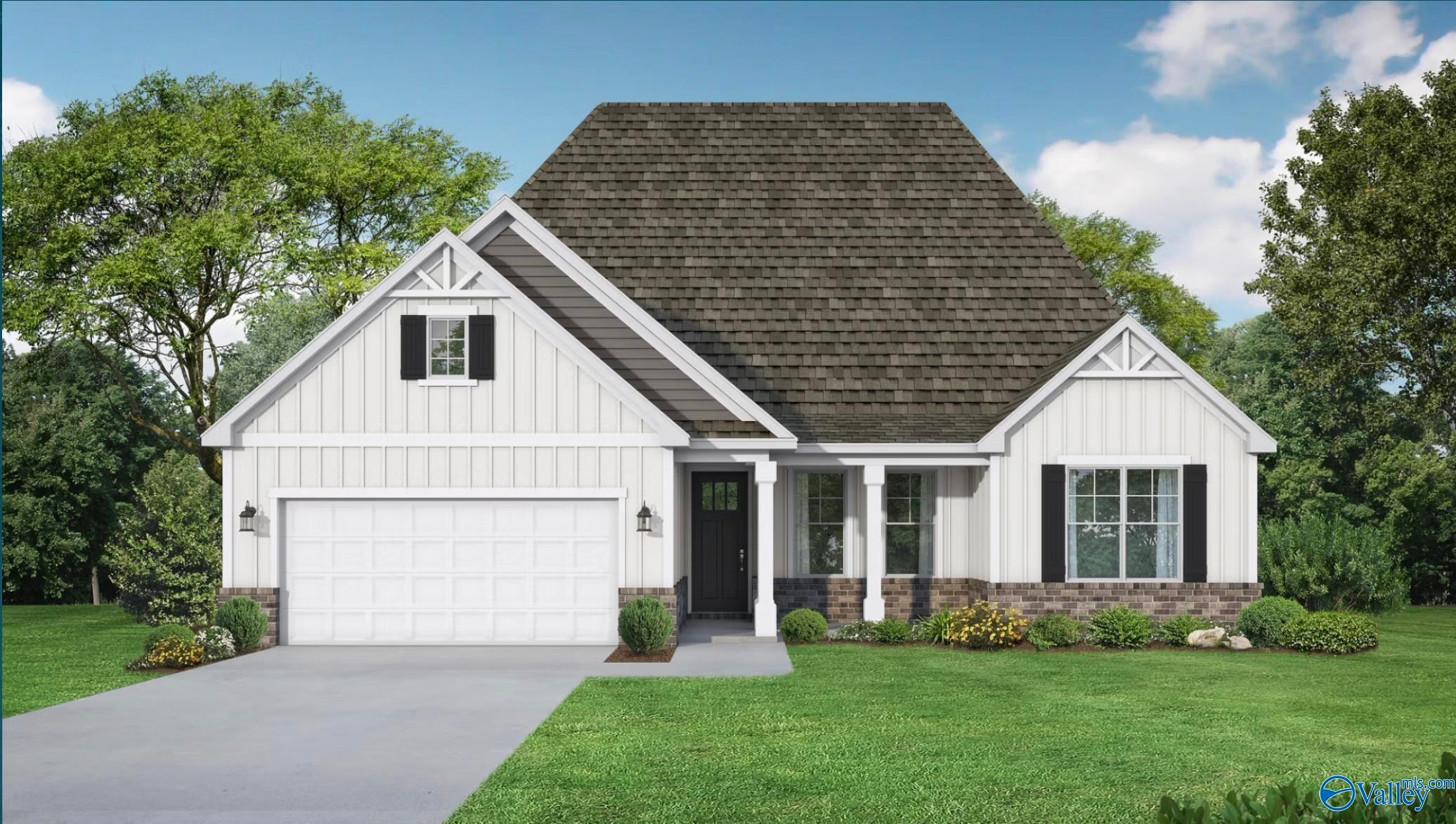 White one-story 3-bedroom home with 2-car garage, covered porch, and landscaping in Forest Glen, Hazel Green, Alabama