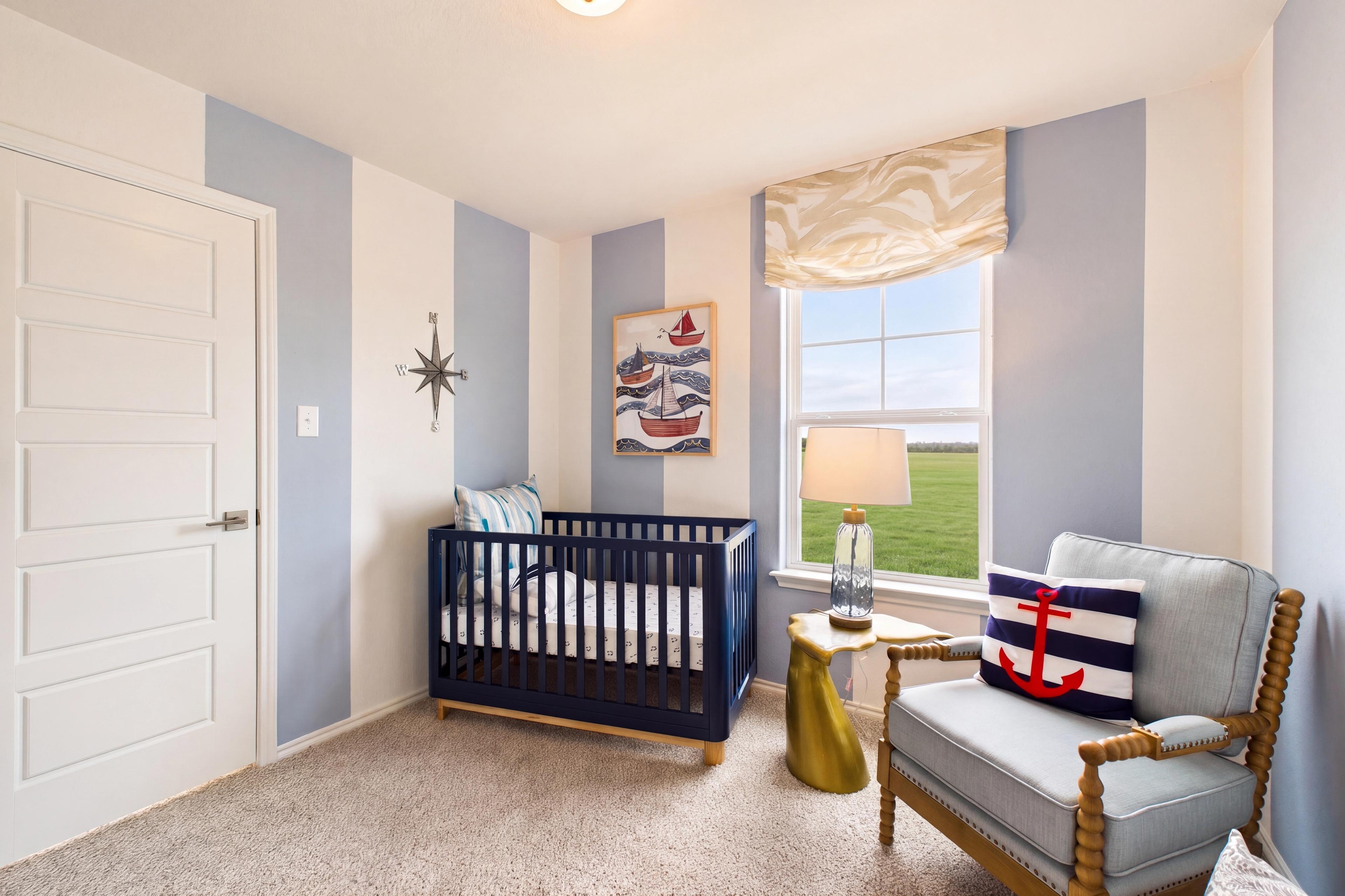 Spacious bedroom with large window located in the model home in San Antonio, TX