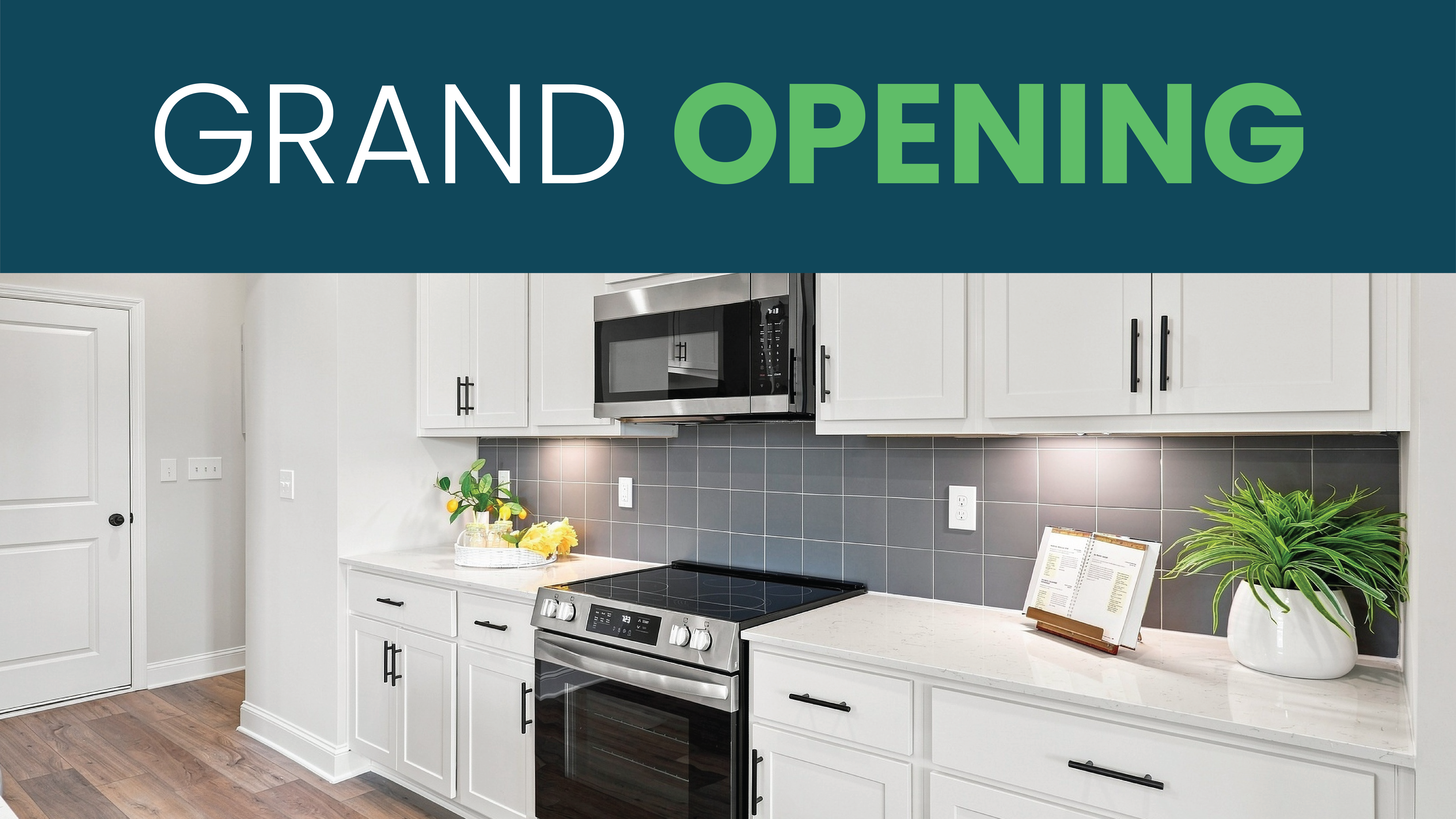 Grand opening banner over modern white kitchen with stainless appliances at Kendall Glades, a Davidson Homes community in Huntsville
