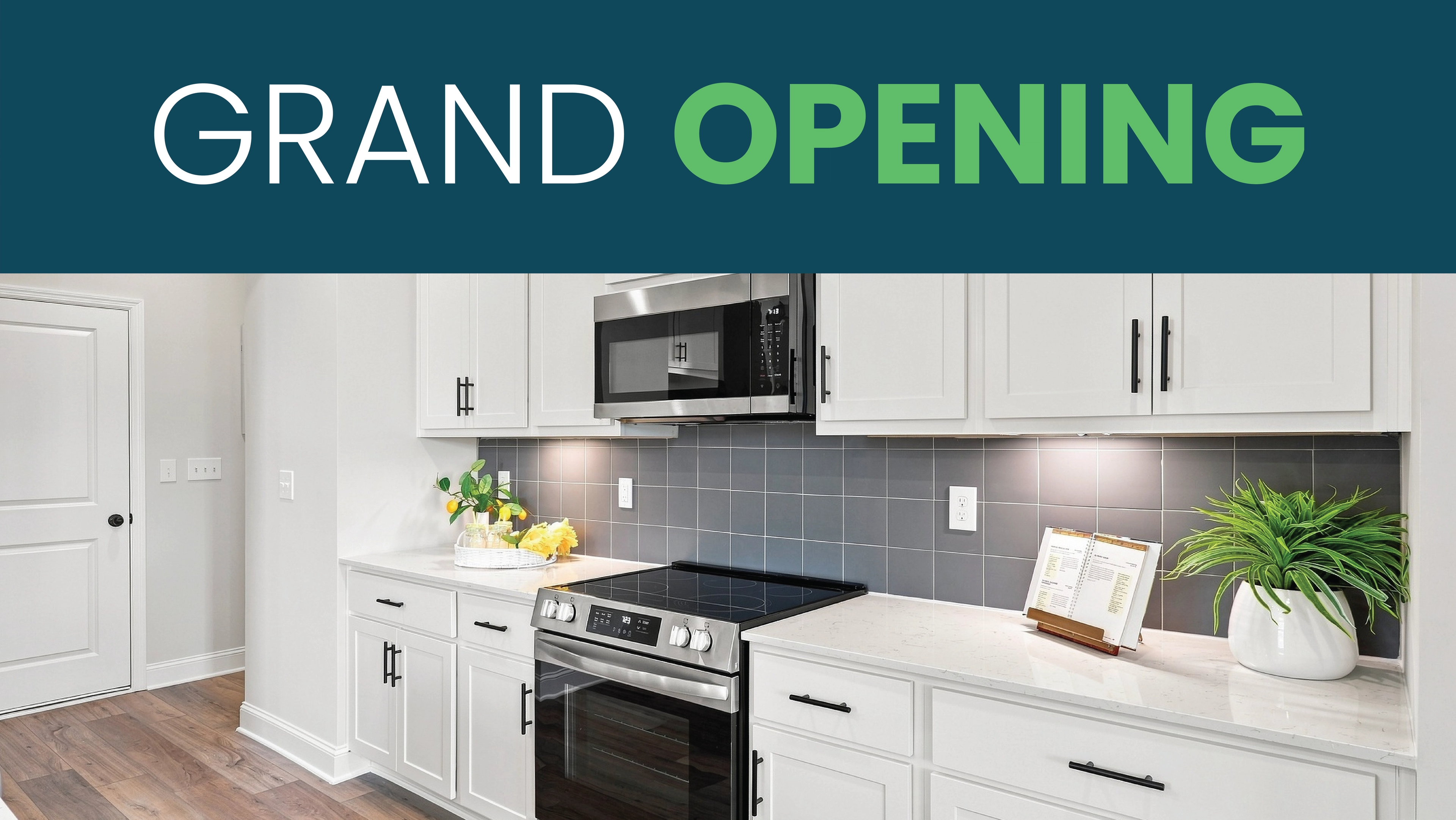 Grand opening banner over modern white kitchen with stainless appliances at Kendall Glades, a Davidson Homes community in Huntsville