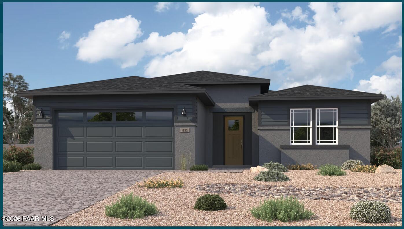 Modern single-story Durango II F exterior with 3-car garage, desert landscaping in South Ranch, Prescott, Arizona by Davidson Homes