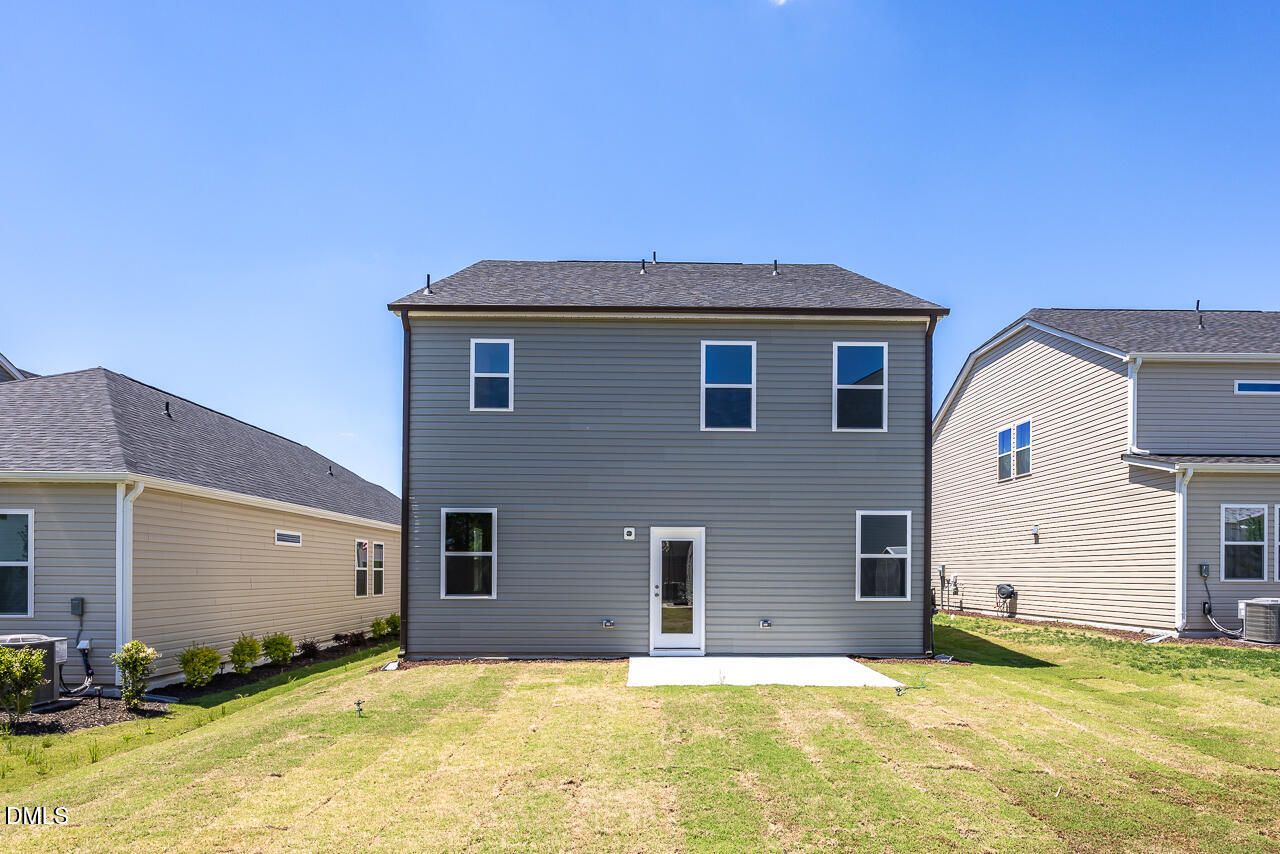 Rear exterior view of The Adalynn A floor plan by Davidson Homes in Gregory Village, Lillington, North Carolina.