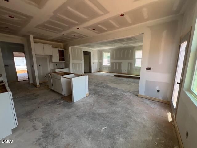 Open-concept kitchen and living area under construction in The Gavin C floor plan, Gregory Village, Lillington, NC.