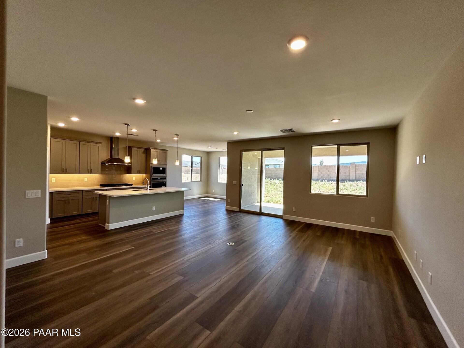 Open-concept kitchen and living area in The Harmony C floor plan at North Ridge, Pronghorn Ranch in Prescott Valley.
