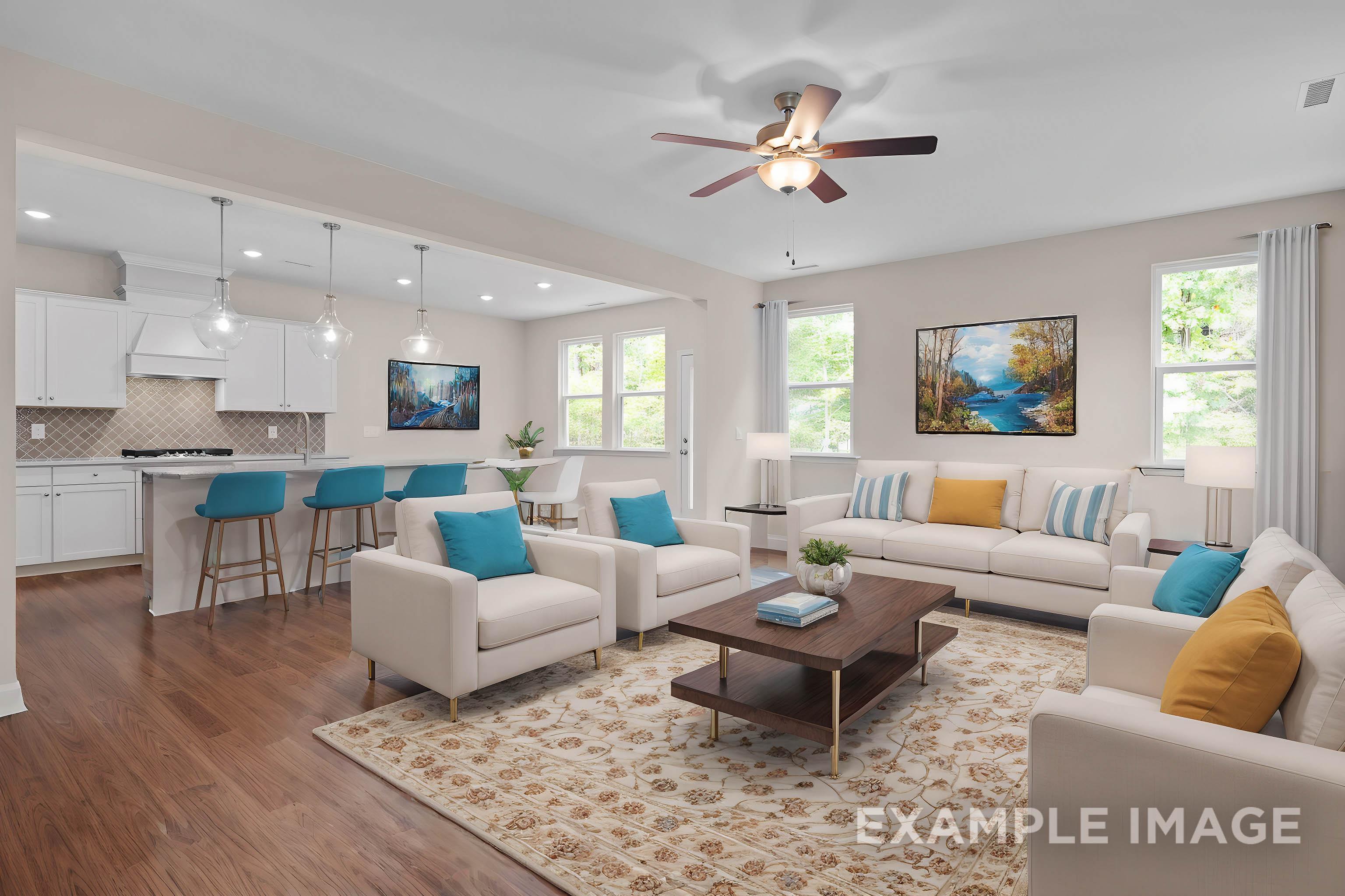 Spacious open-concept living room and kitchen in The Gavin B by Davidson Homes, with white cabinetry, modern sofas, and large windows