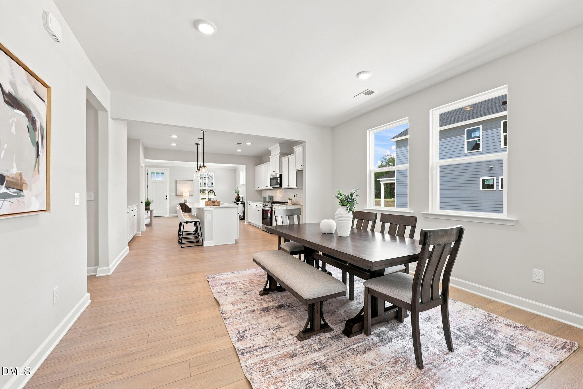 Open-concept dining area and kitchen in The Harris C floor plan at Forestville Yard, Knightdale, North Carolina.
