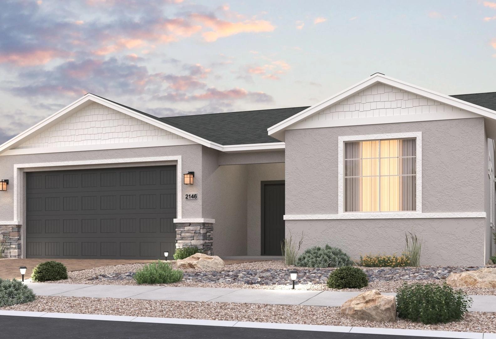 The Harmony single-story home exterior with gray siding, stone accents, gabled roof, and 3-car garage at dusk in Prescott Valley