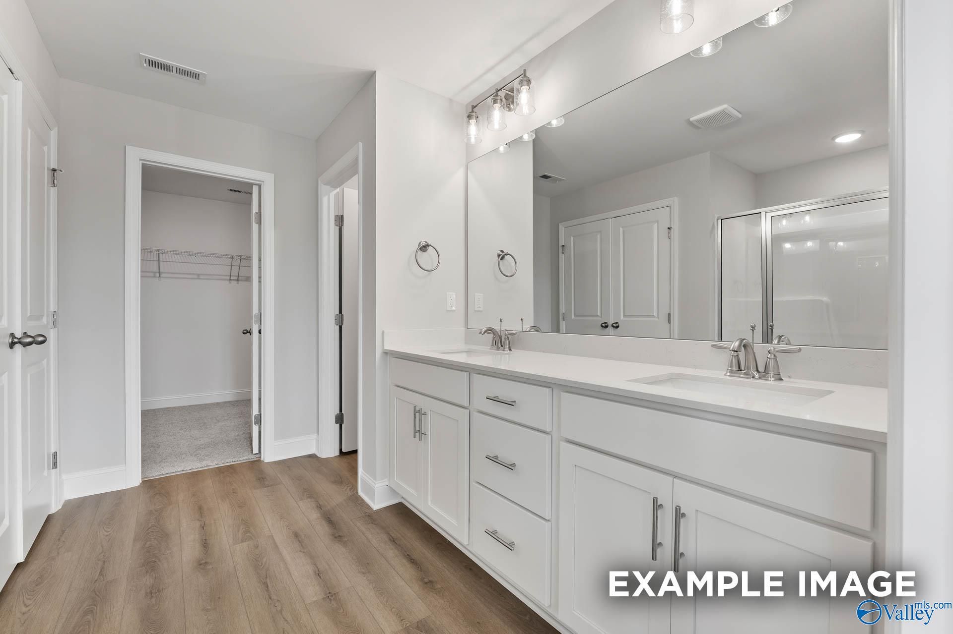 Modern master bathroom featuring double vanity, quartz countertop, walk-in shower in Davidson Homes The Chelsea D, New Market, AL