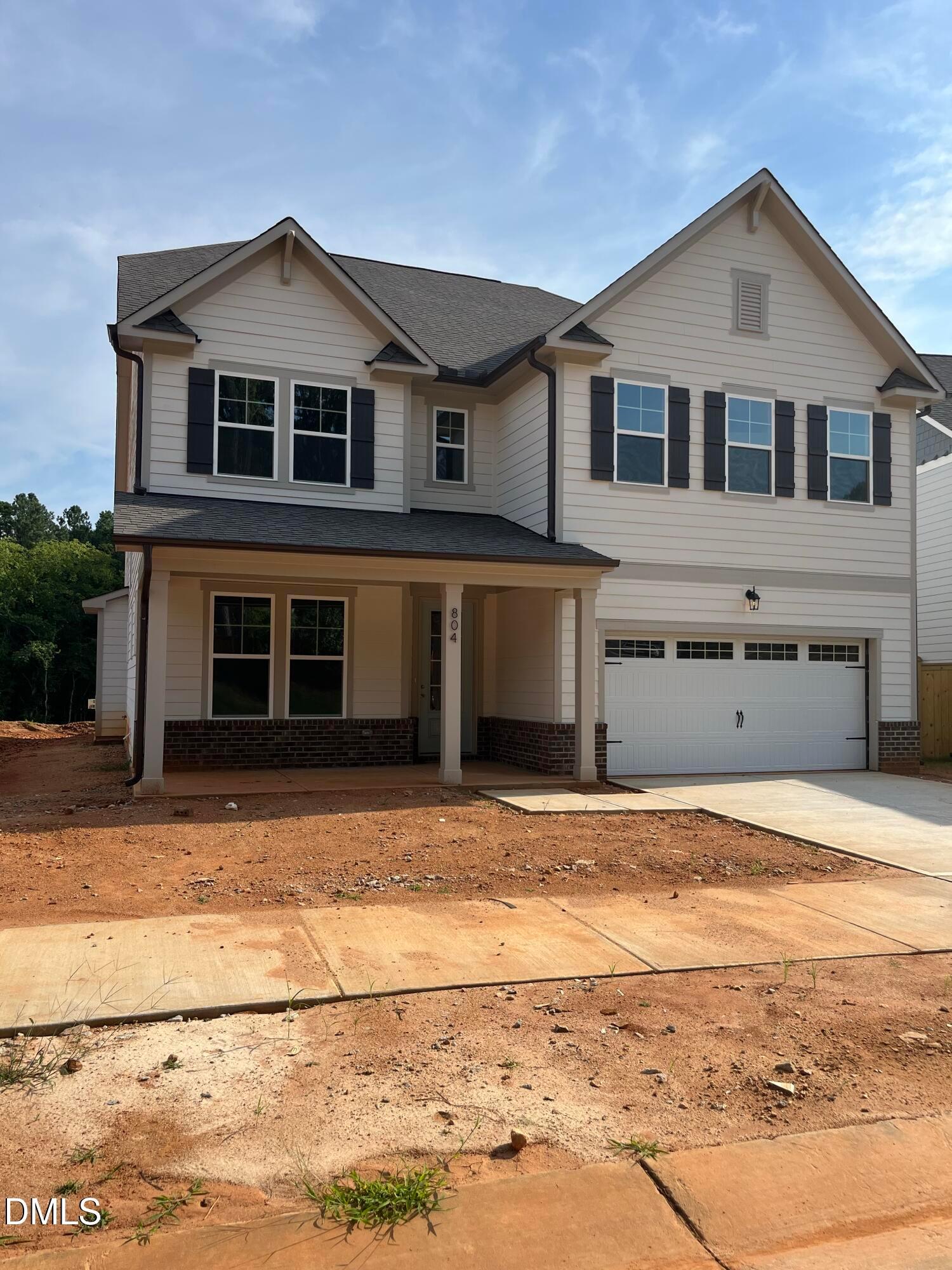 Three-story Aspen floor plan by Davidson Homes with two-car garage in Sage on North Main, Wake Forest, North Carolina.