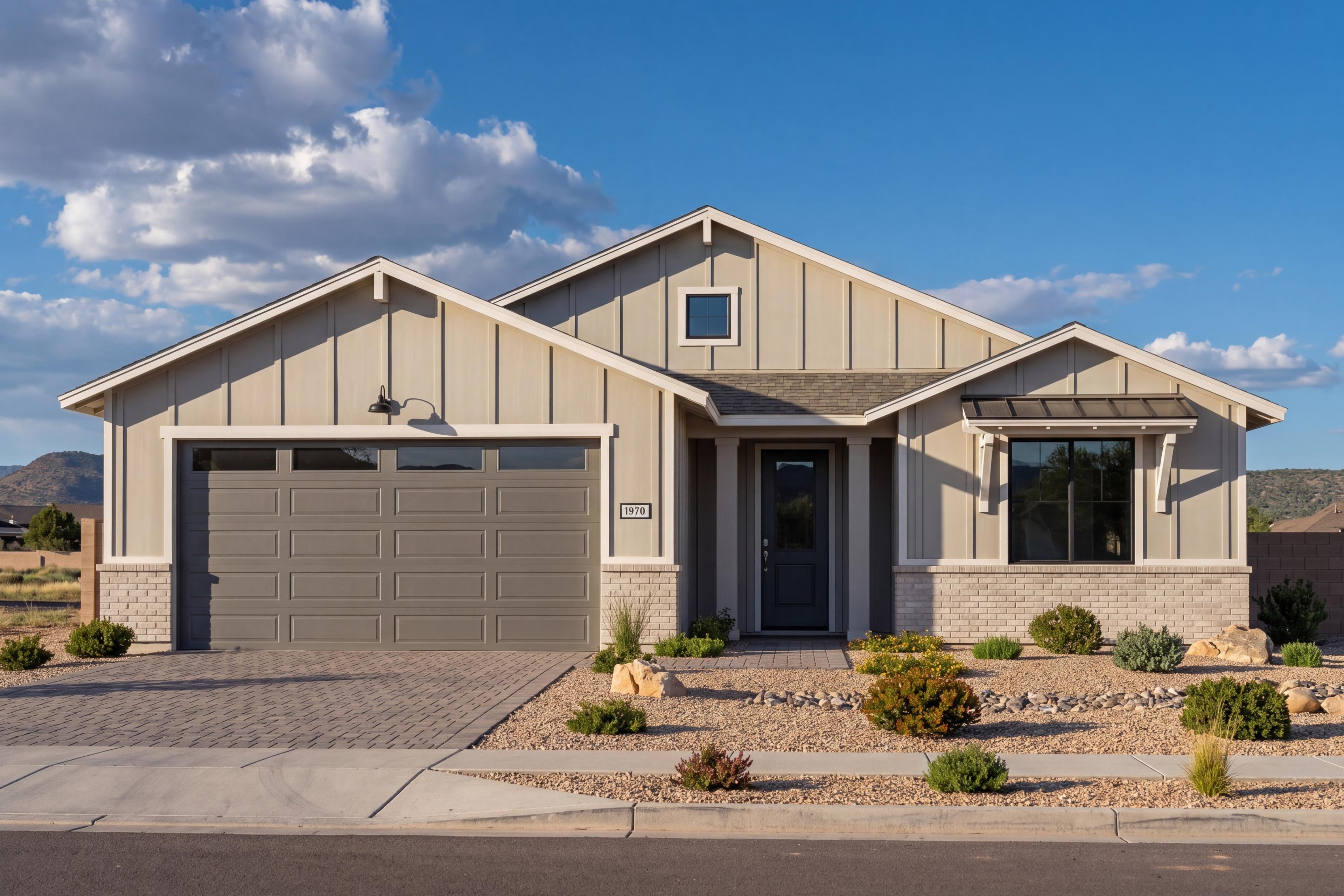 Modern farmhouse exterior of The Sheridan II G in Prescott with 3-car garage, board-and-batten siding, and stone accents.