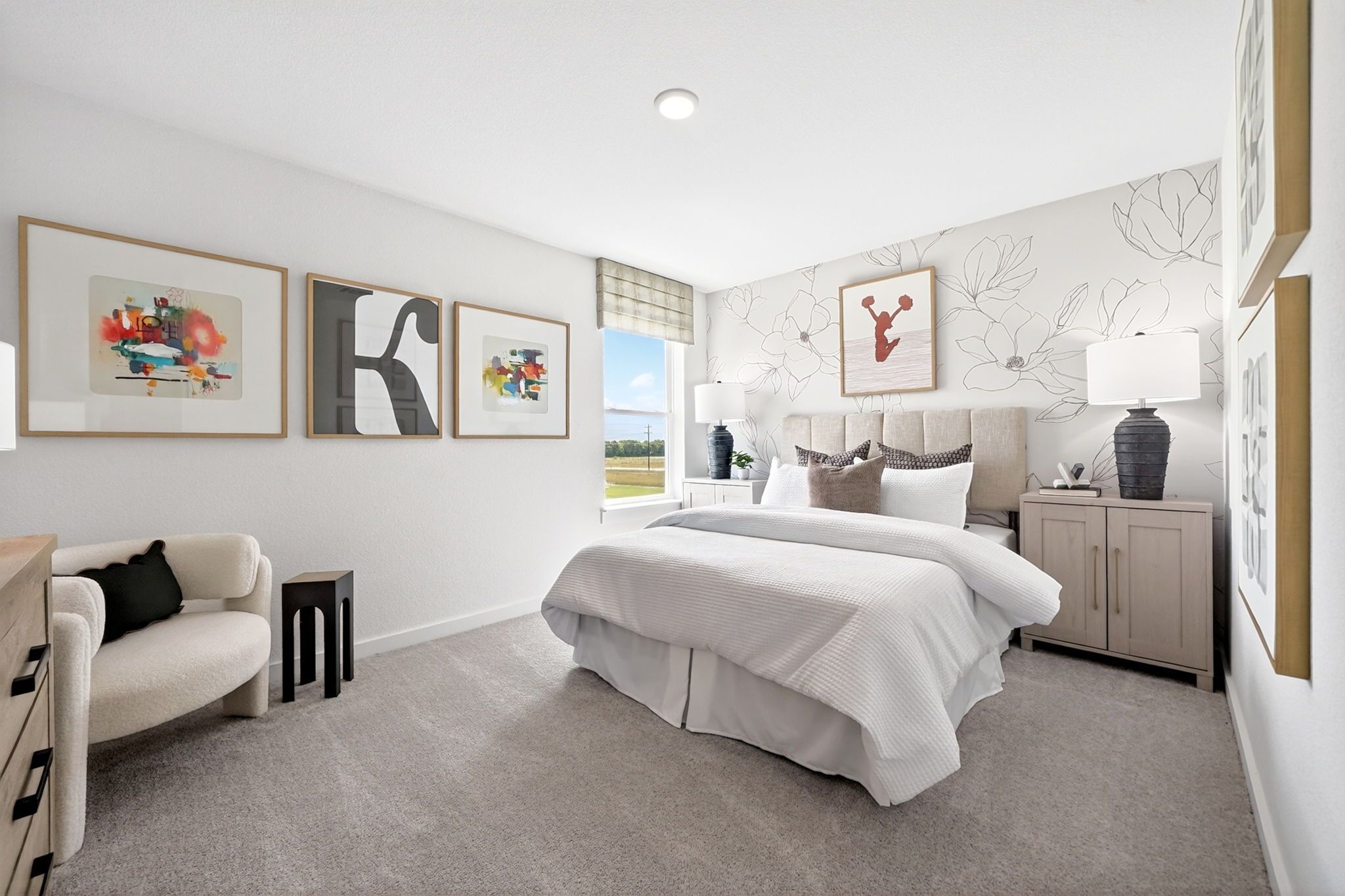 Cozy bedroom with floral accent wall and neutral decor at Parks at Foster Crossing by Davidson Homes in Anna, Texas.