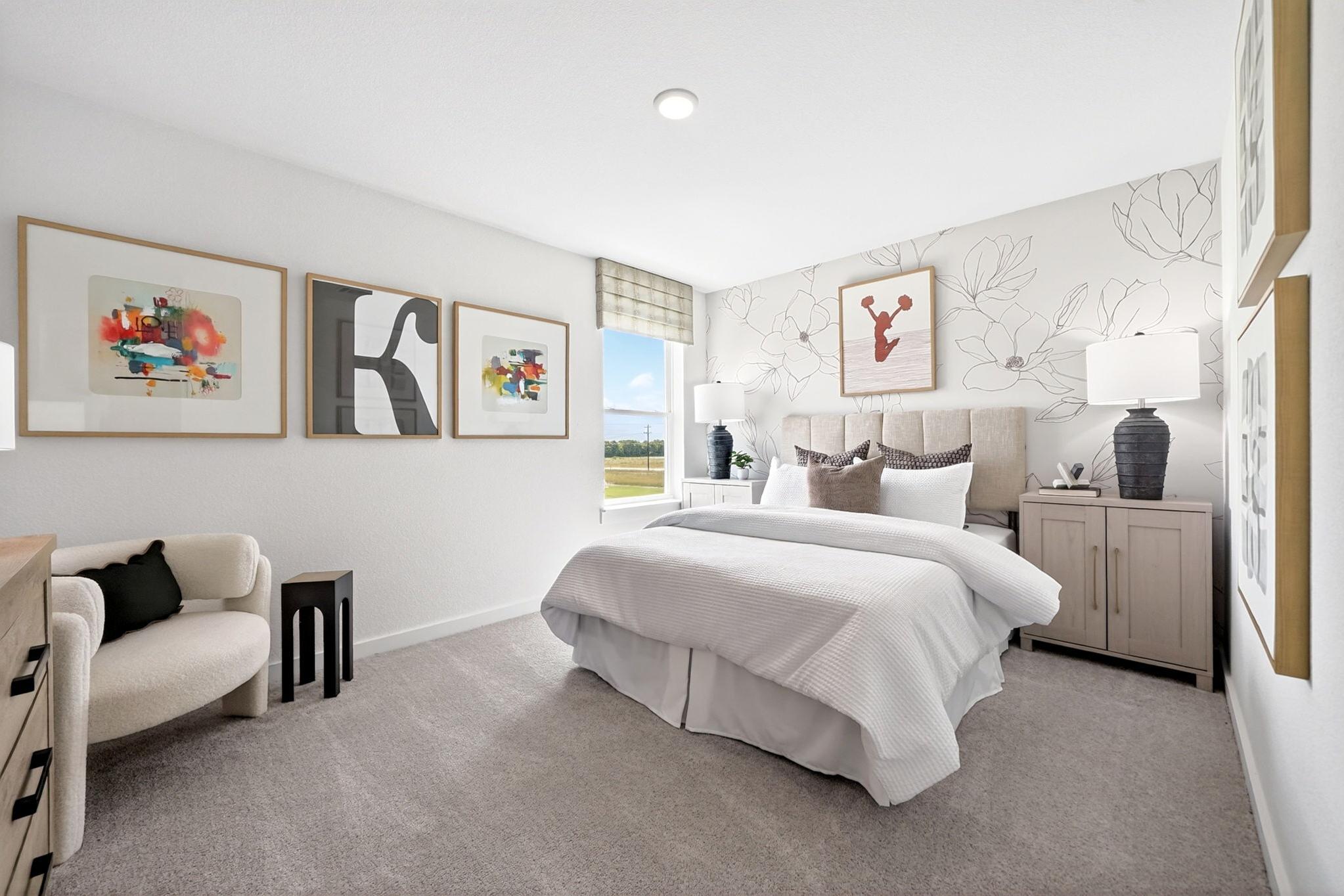 Cozy bedroom with floral accent wall and neutral decor at Parks at Foster Crossing by Davidson Homes in Anna, Texas.