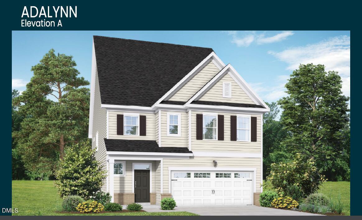 Two-story Adalynn A elevation featuring beige siding, black roof, two-car garage, and landscaped yard in Gregory Village, Lillington, NC