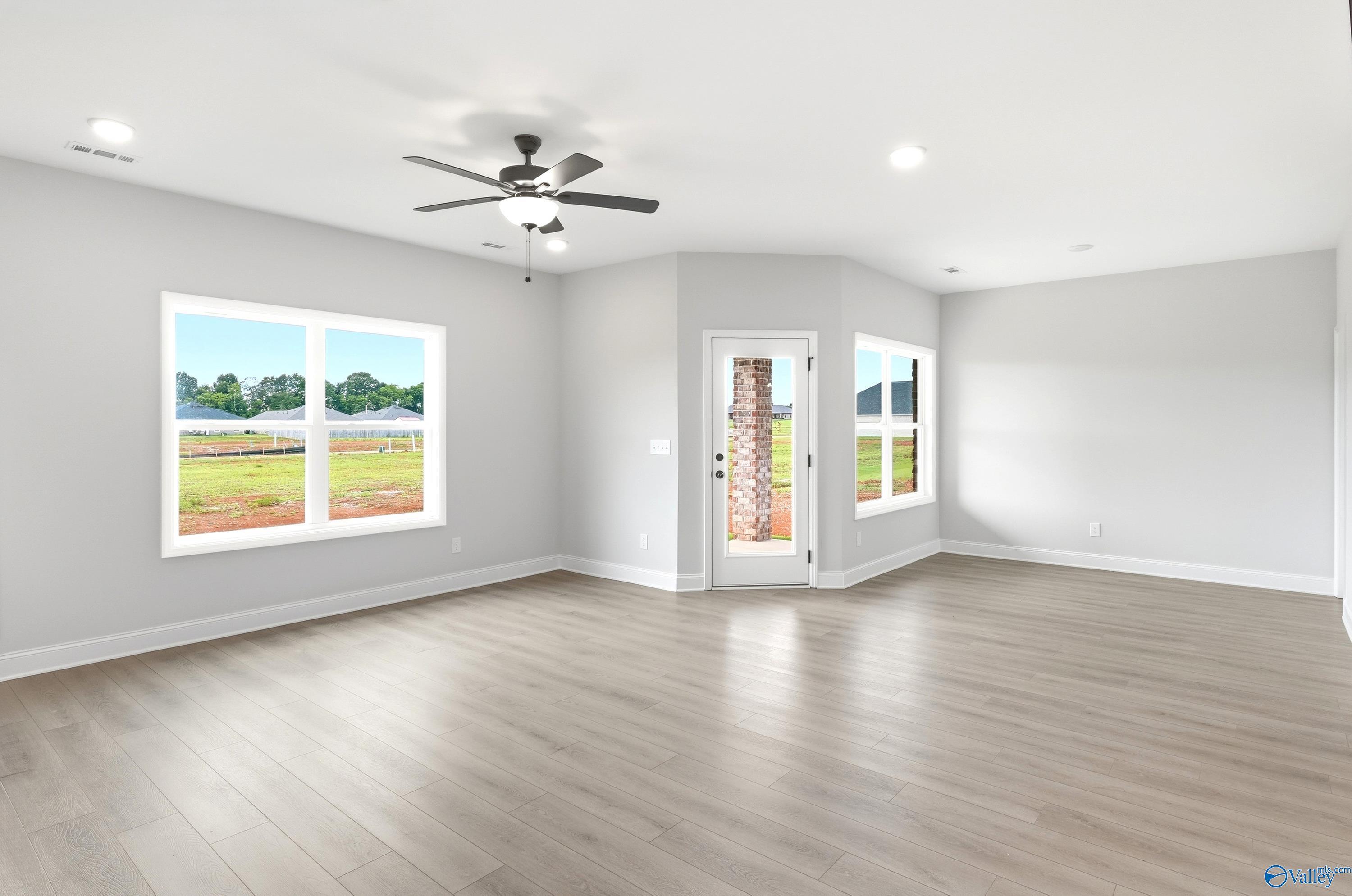 Spacious, light-filled living area in The Daphne floor plan by Davidson Homes at Lynn Meadows in Meridianville, Alabama.