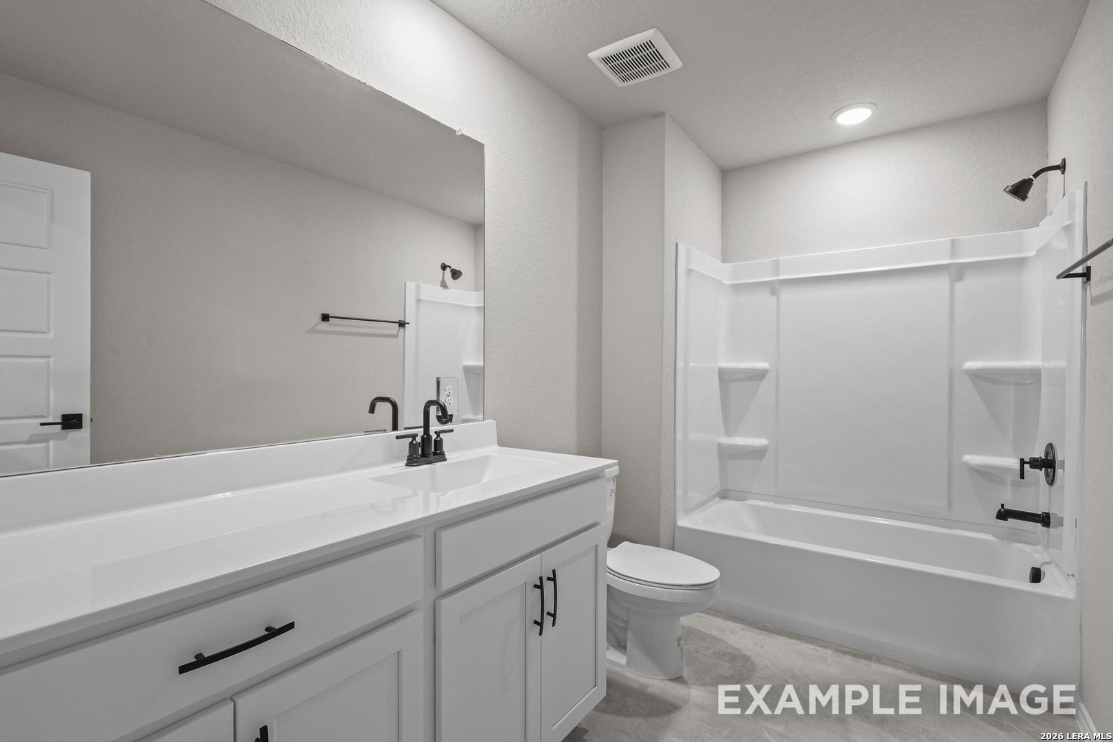 Full bathroom with white vanity, matte black fixtures, and tub shower combo in Davidson Homes The Murray H, Converse, TX