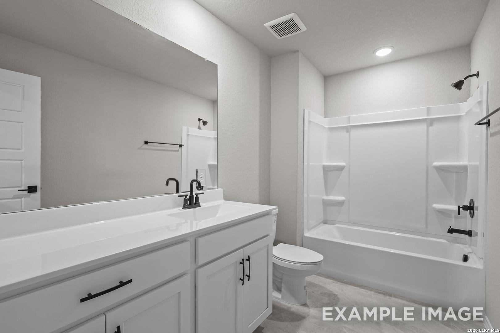Full bathroom with white vanity, matte black fixtures, and tub shower combo in Davidson Homes The Murray H, Converse, TX