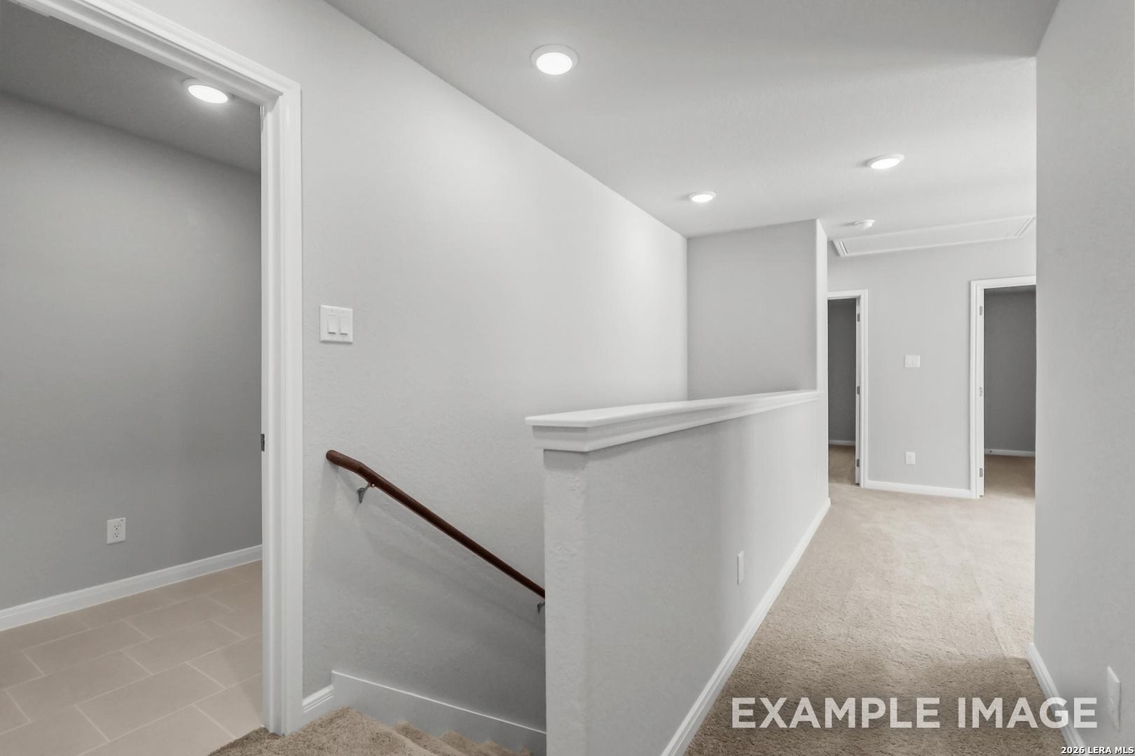 Bright second-story hallway with carpeted landing and recessed lighting in The Gillian A floor plan, Cedar Heights, SA.