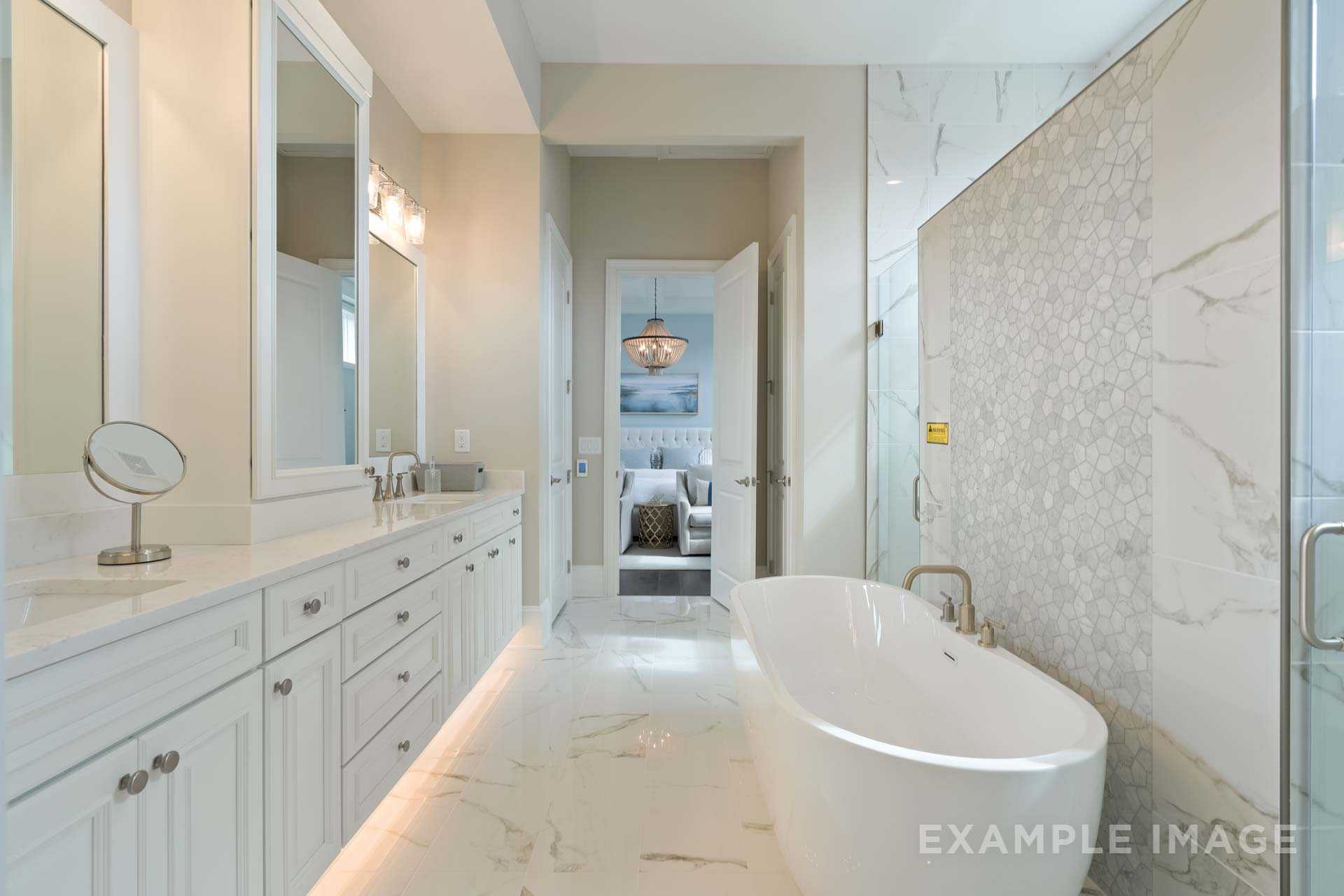 Spacious master bathroom in The Seaside by Davidson Homes featuring freestanding tub, double vanity, and tiled walk-in shower