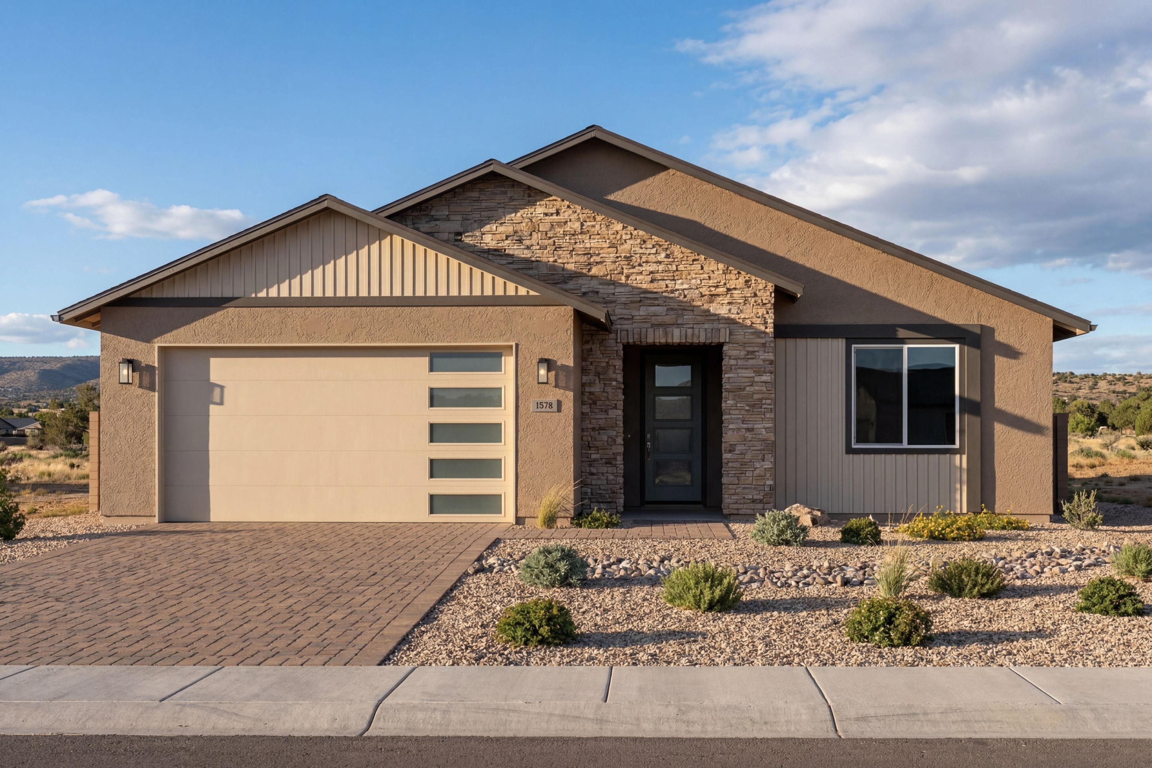 Exterior elevation of The Sheridan II by Davidson Homes in Prescott, featuring stone accents and a 3-car garage.