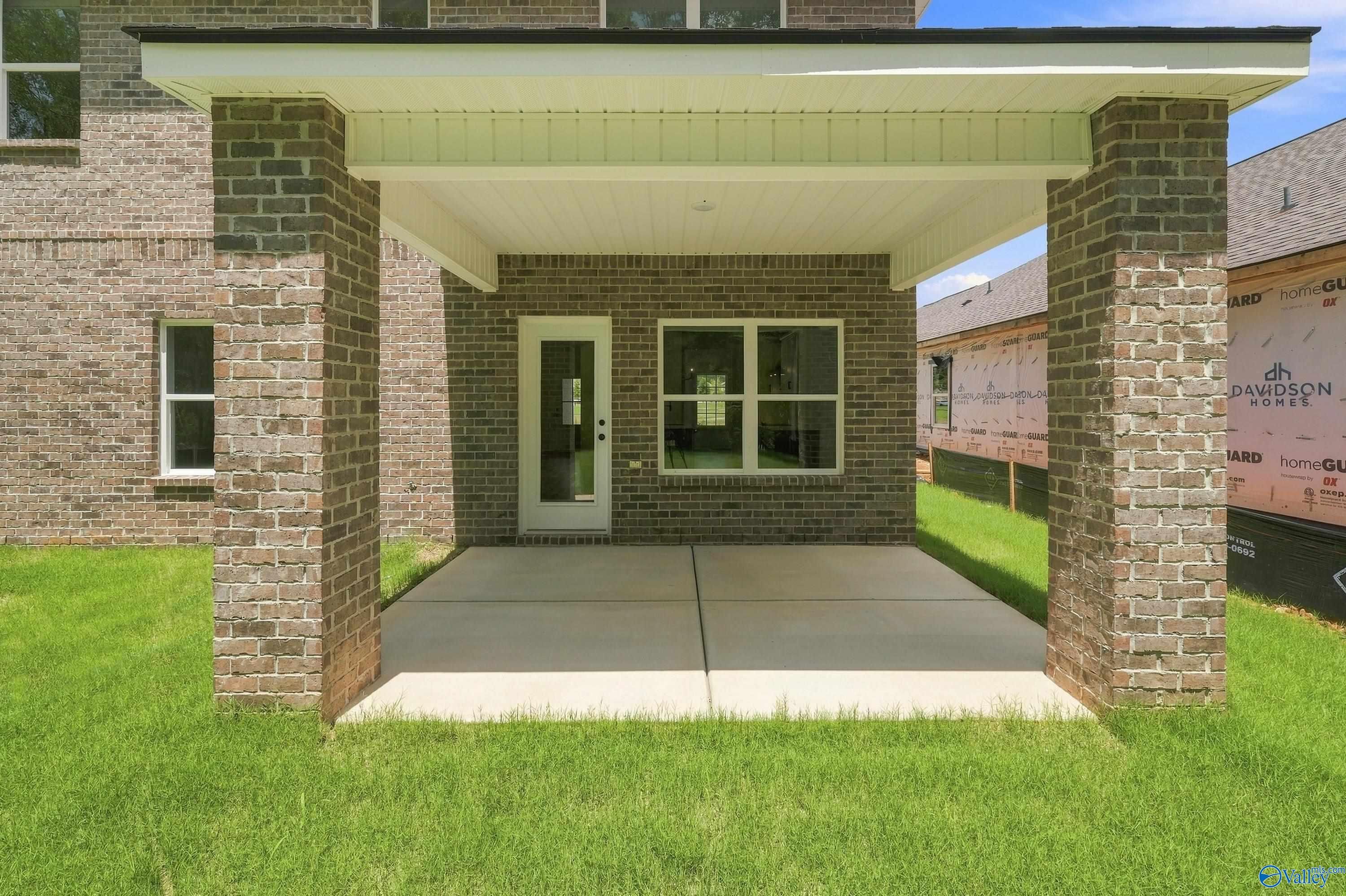 Covered brick patio of The Shelby B floor plan at Davidson Homes in Jaguar Hills, Huntsville, Alabama.