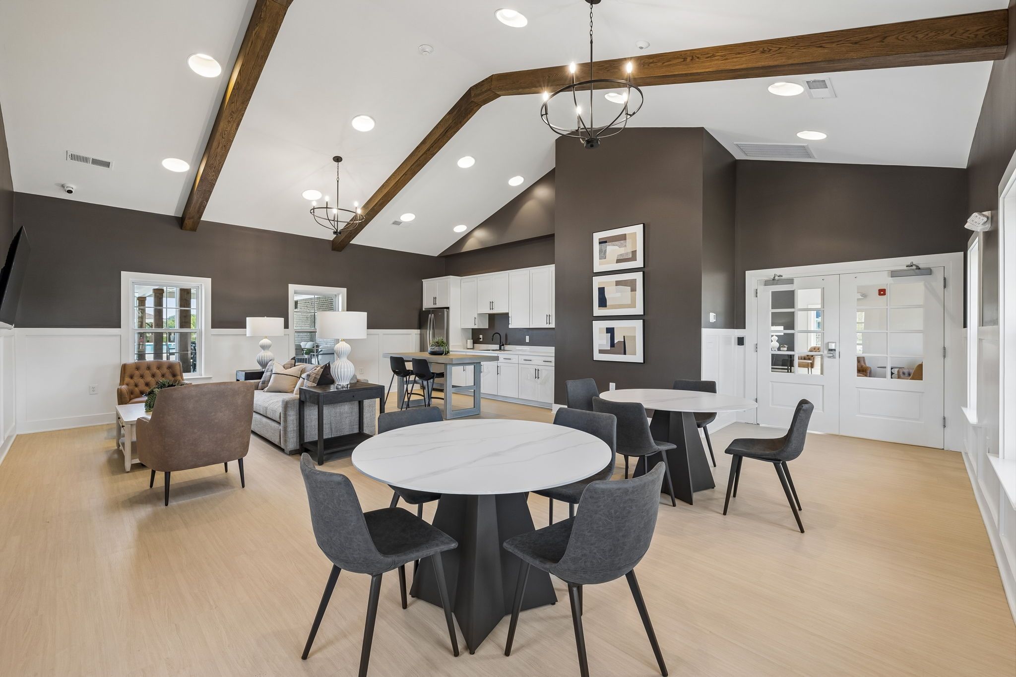 Spacious clubhouse lounge at Bradshaw Farms in Mt. Juliet, TN by Davidson Homes with vaulted ceilings and modern seating.