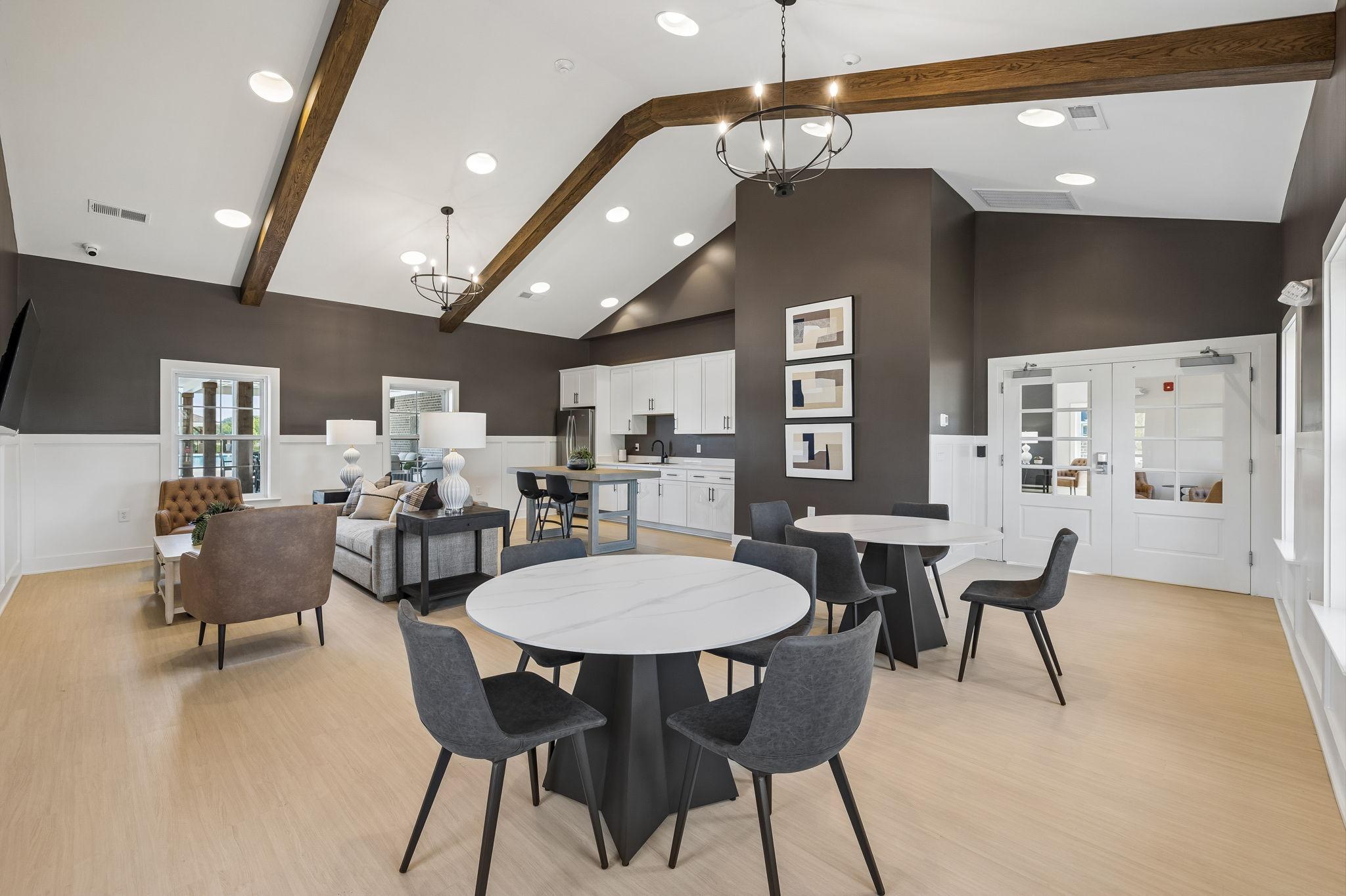 Spacious clubhouse lounge at Bradshaw Farms in Mt. Juliet, TN by Davidson Homes with vaulted ceilings and modern seating.