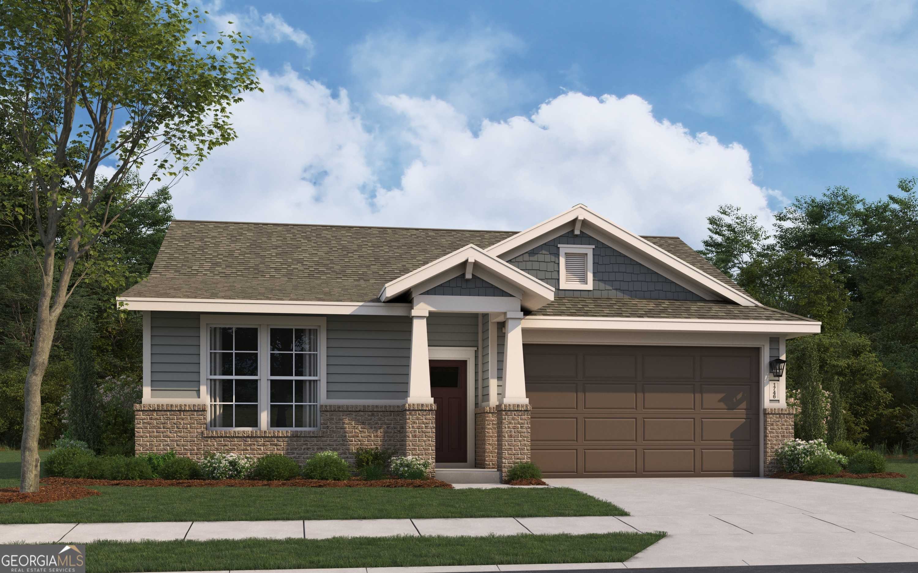 Single-story Phoenix home exterior with beige siding, brick accents, 2-car garage, and lush trees in Ivy Glen, Perry, Georgia