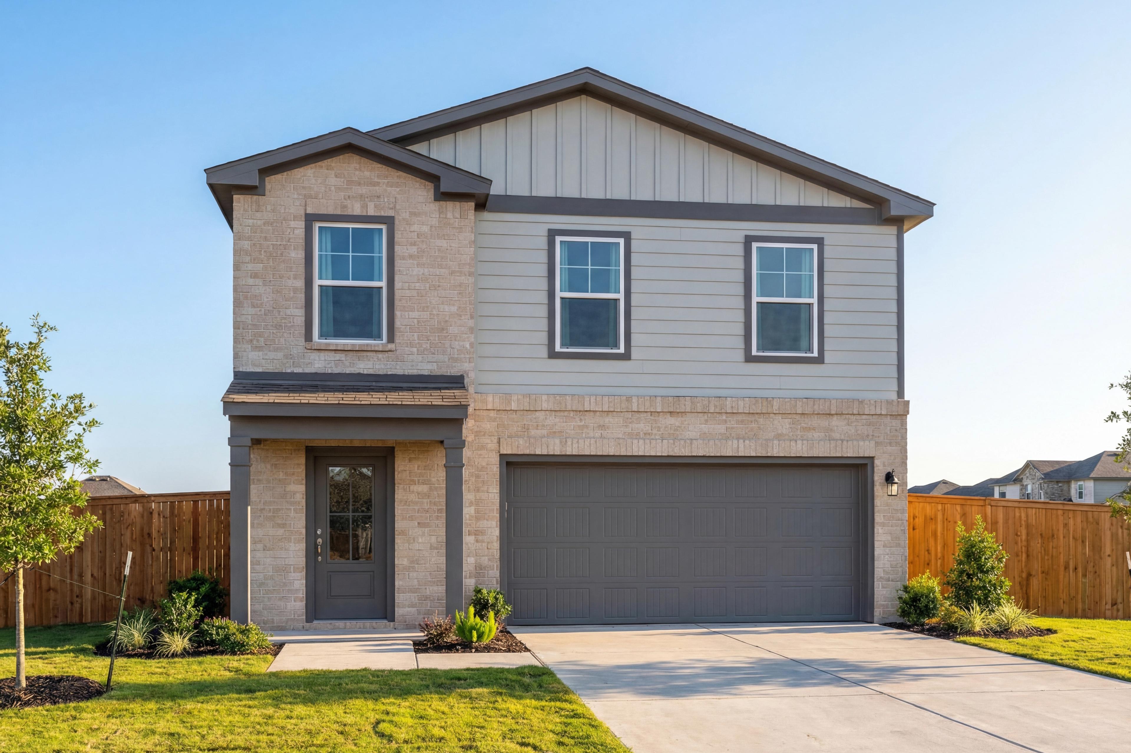 Two-story Trinity D home elevation by Davidson Homes in San Antonio featuring beige brick, gray siding, covered porch, and 2-car garage