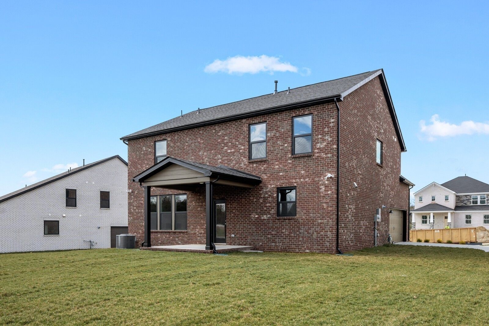 Two-story brick exterior of The Henry C floor plan by Davidson Homes in Benders Cove, Mt. Juliet, Tennessee.
