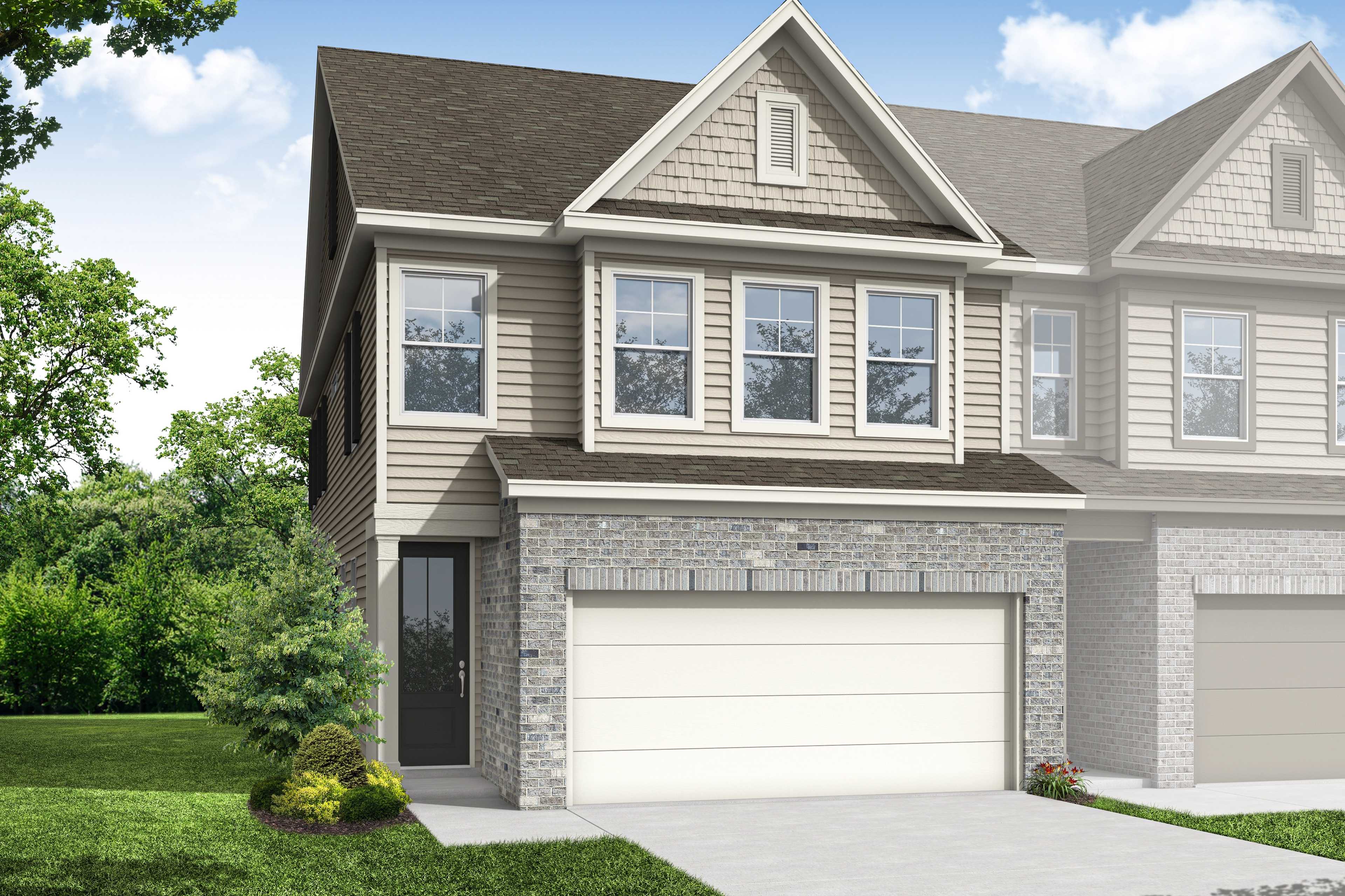 Durham B two-story multi-family home with stone base, siding exterior, dual garages, and landscaped yard in Cumming, GA