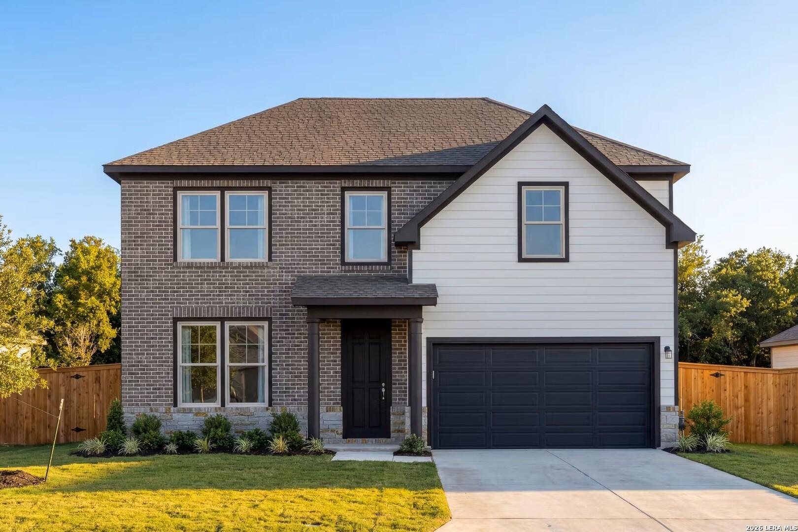 Two-story Murray G floor plan by Davidson Homes with brick and siding exterior in Hannah Heights, Seguin, Texas.